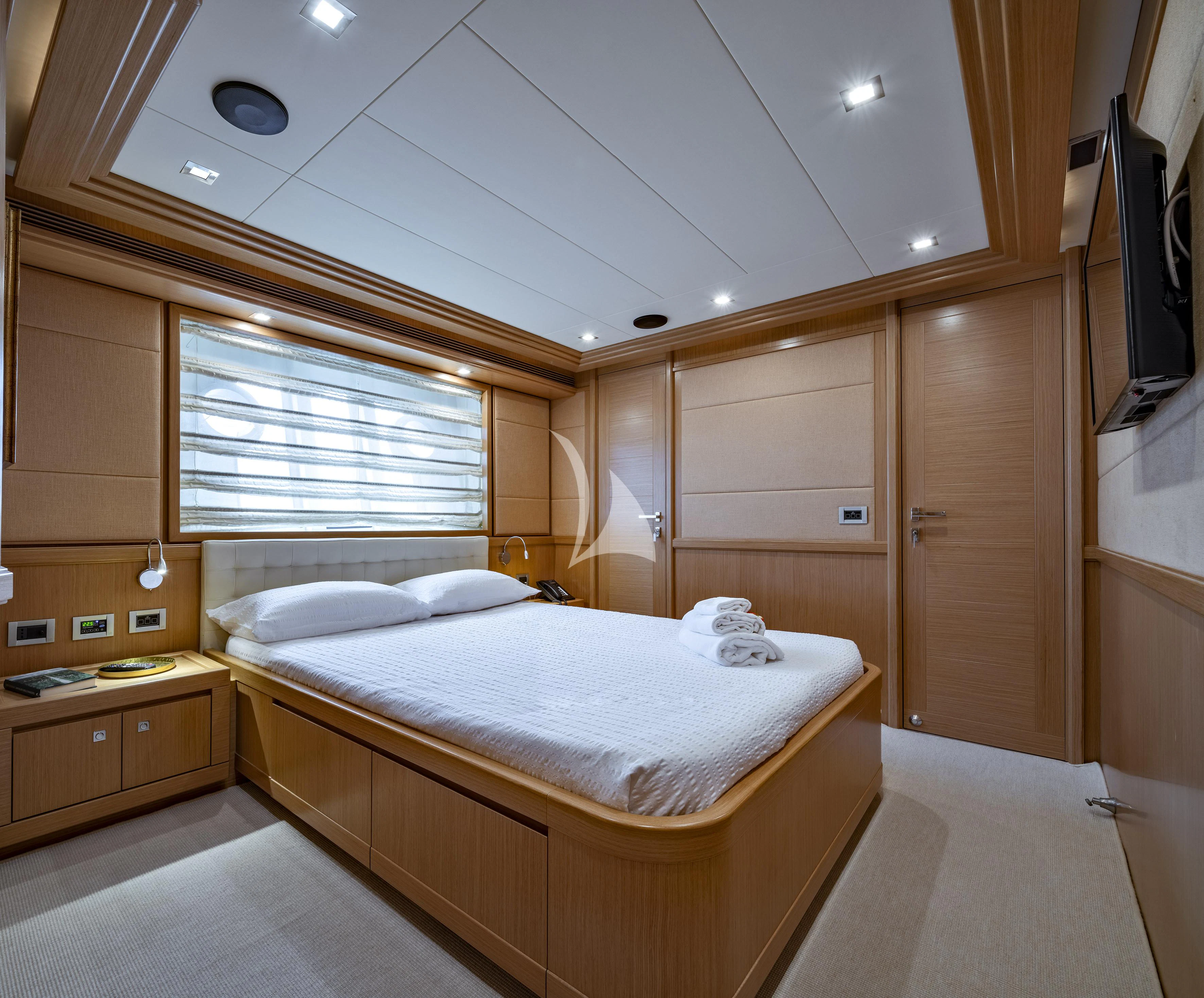 a bedroom with a bed and a closet aboard EOLIA Yacht for Sale