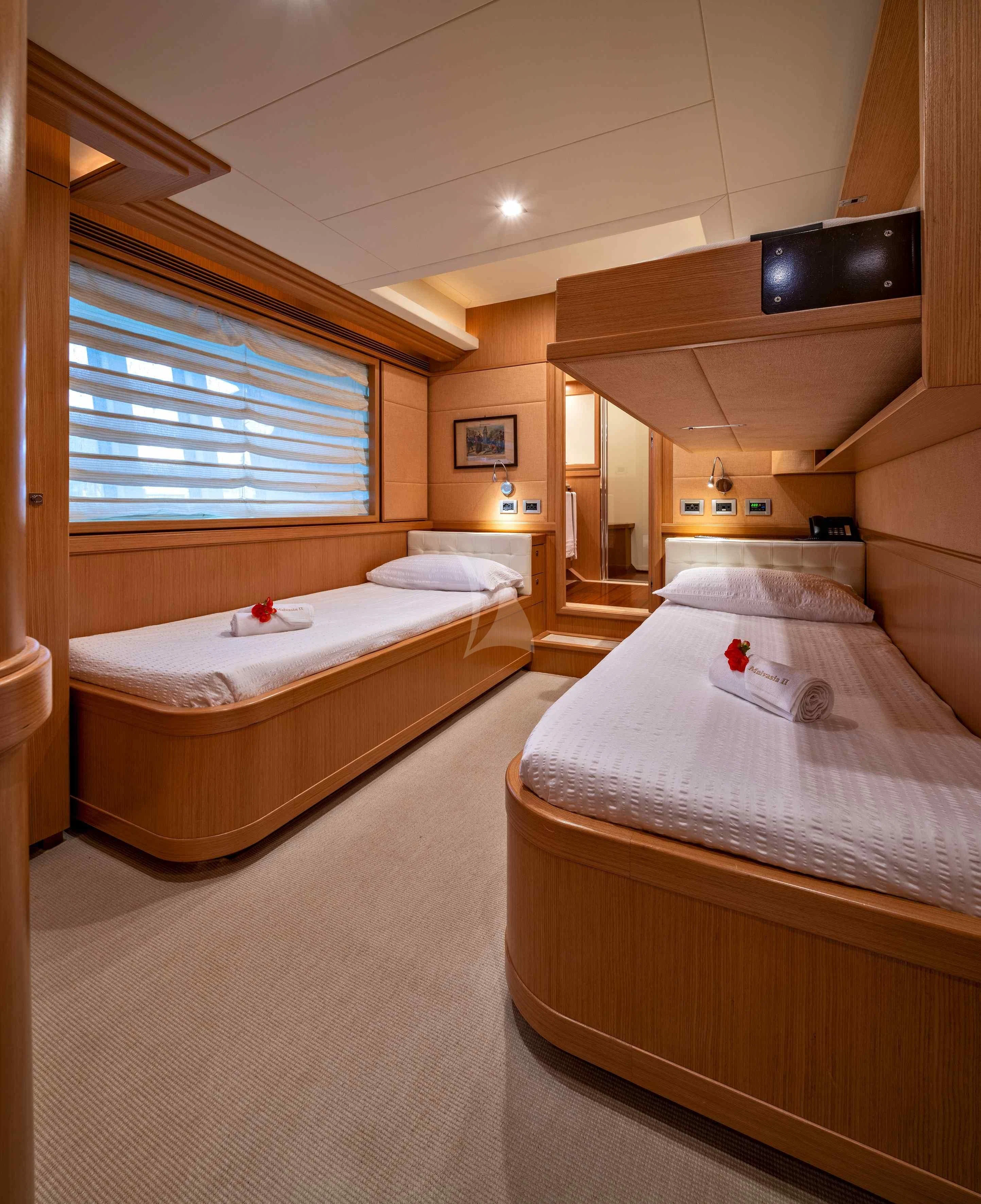 a room with two beds aboard EOLIA Yacht for Sale