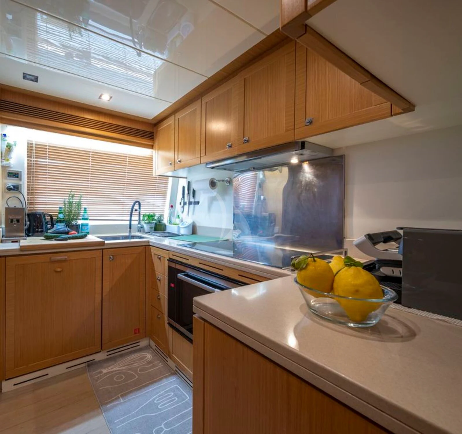 a kitchen with a sink and a stove aboard EOLIA Yacht for Sale