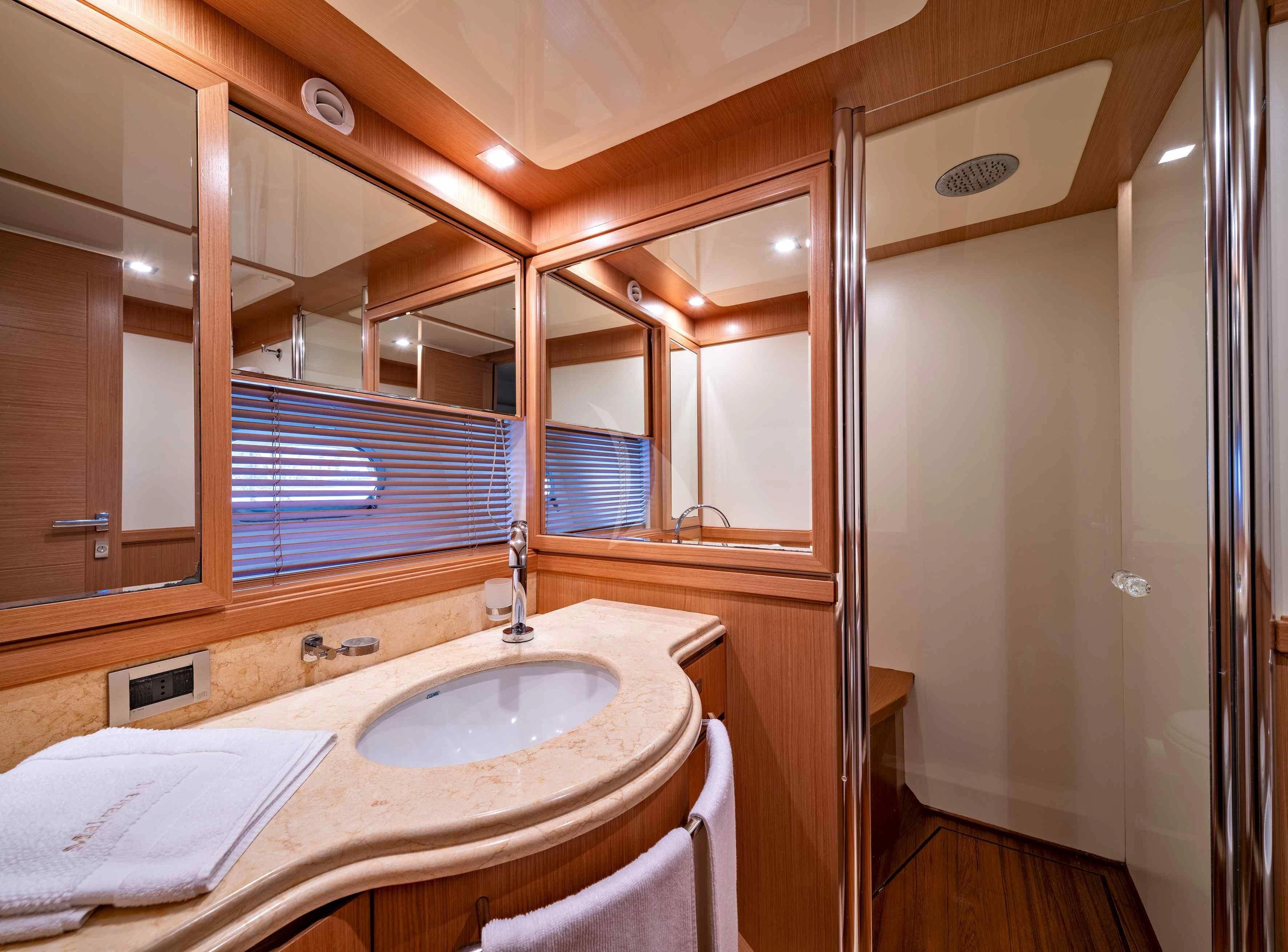a bathroom with a sink and a mirror aboard EOLIA Yacht for Sale
