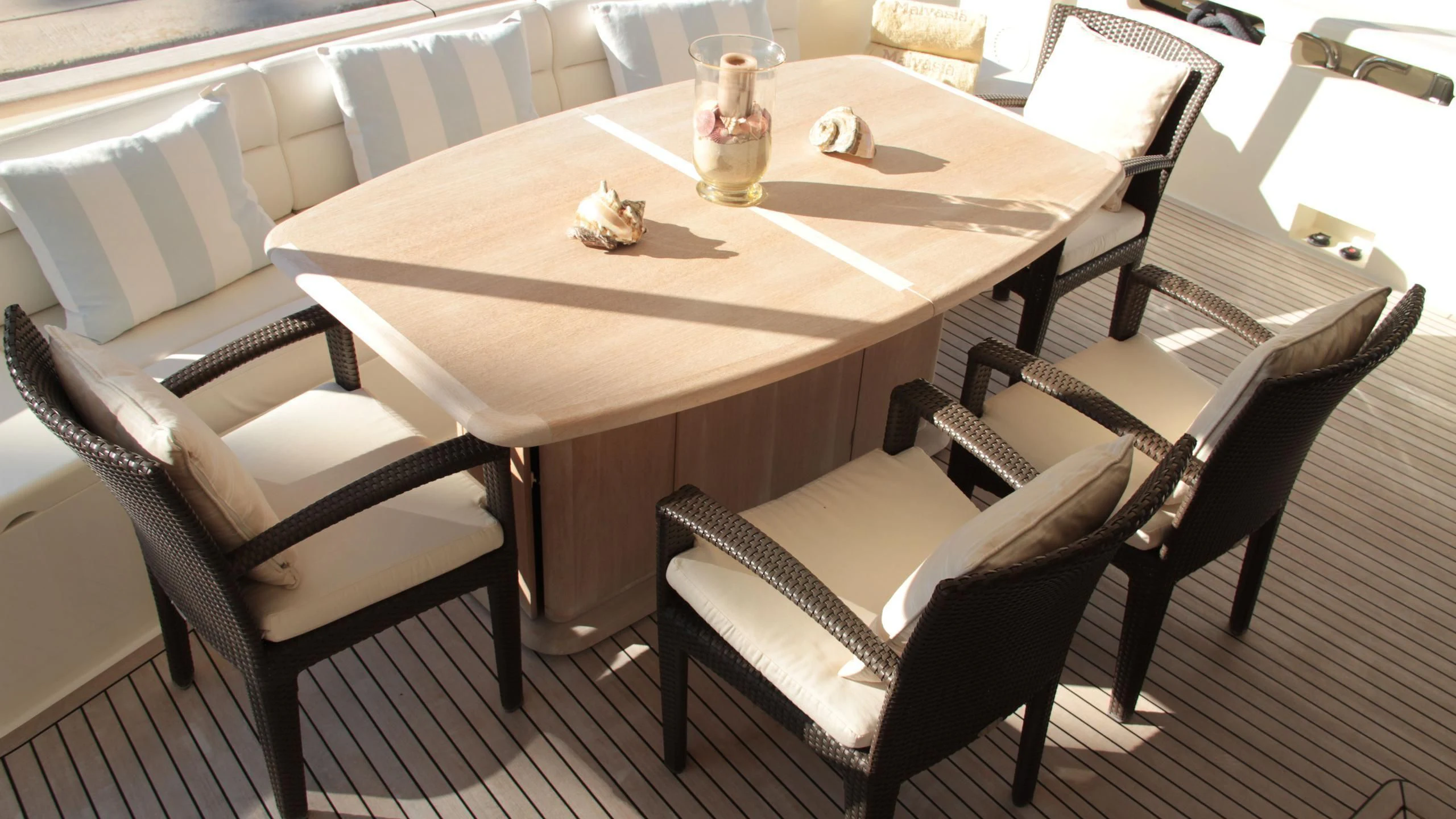a table with chairs around it aboard EOLIA Yacht for Sale