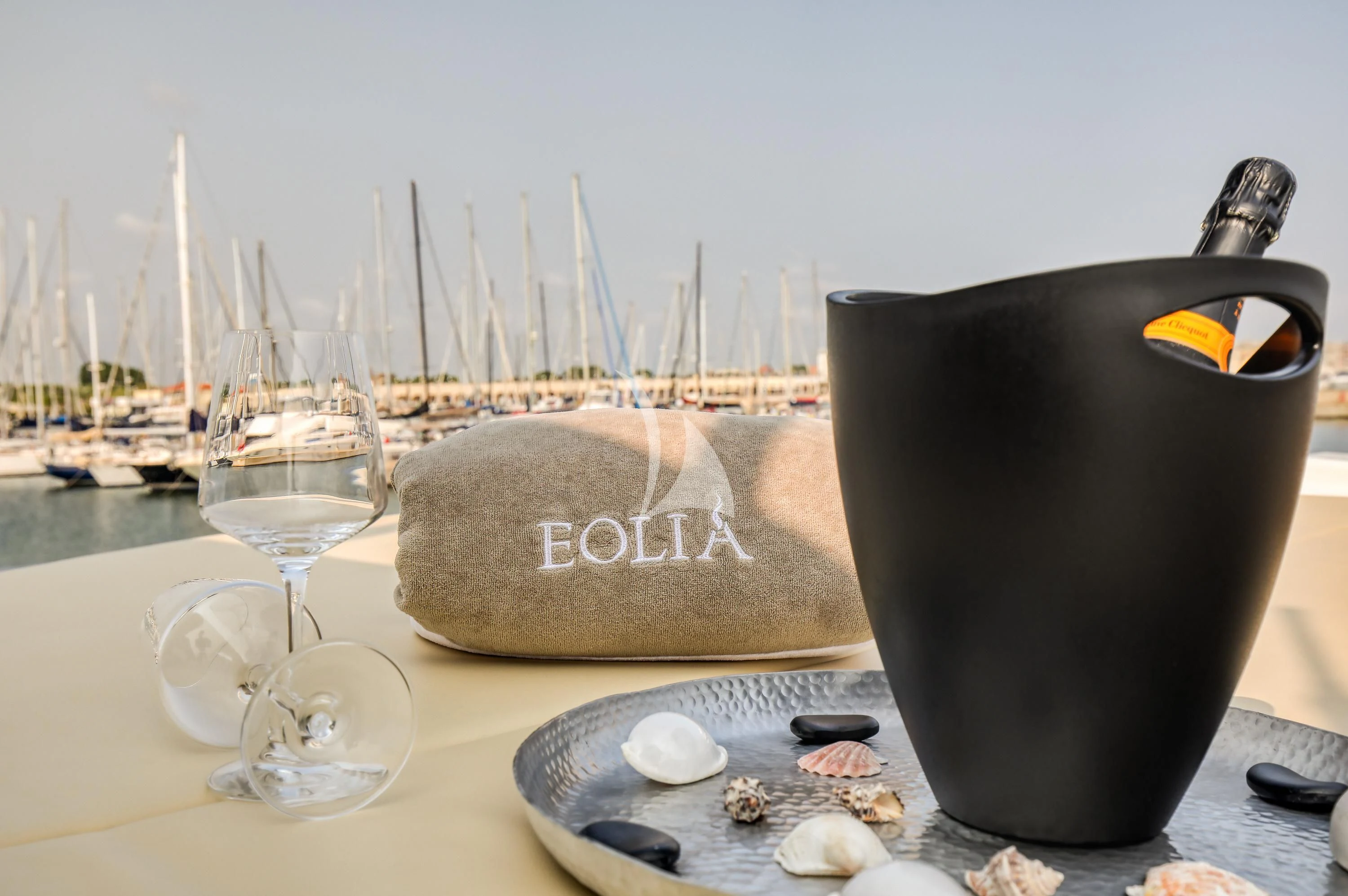 a table with a vase and a plate of food aboard EOLIA Yacht for Sale