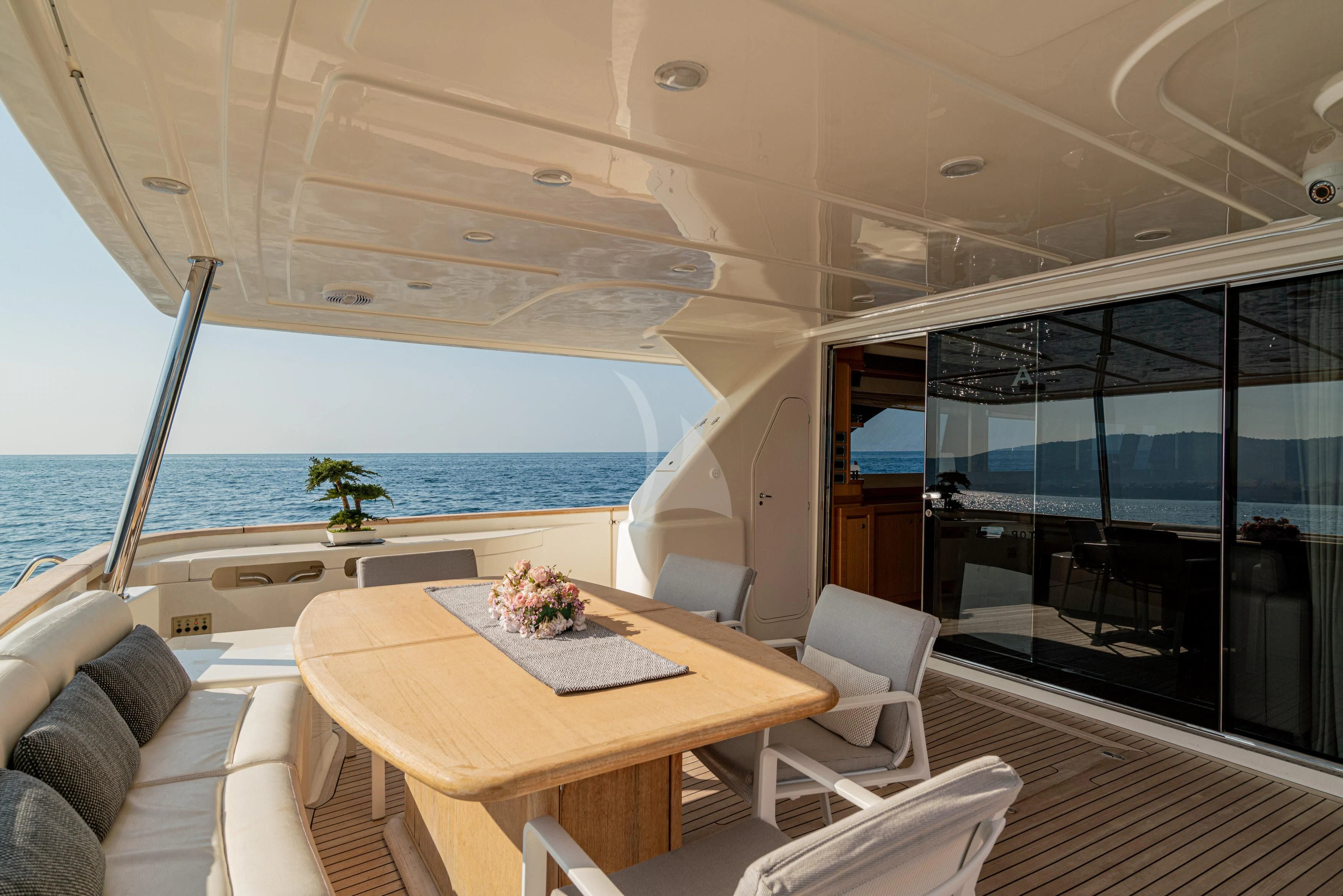 a room with a table and chairs aboard EOLIA Yacht for Sale