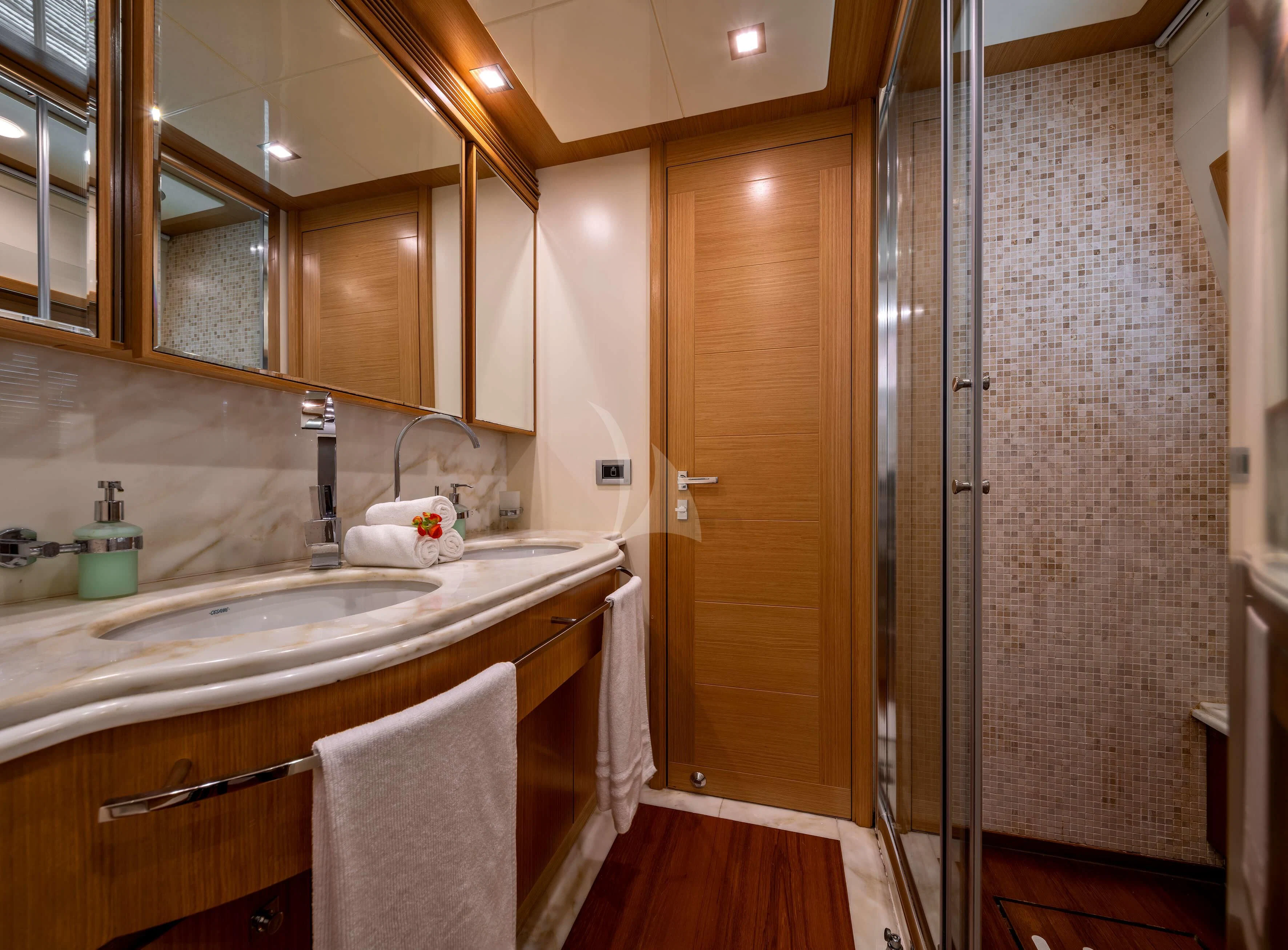a bathroom with a shower unit and sink aboard EOLIA Yacht for Sale