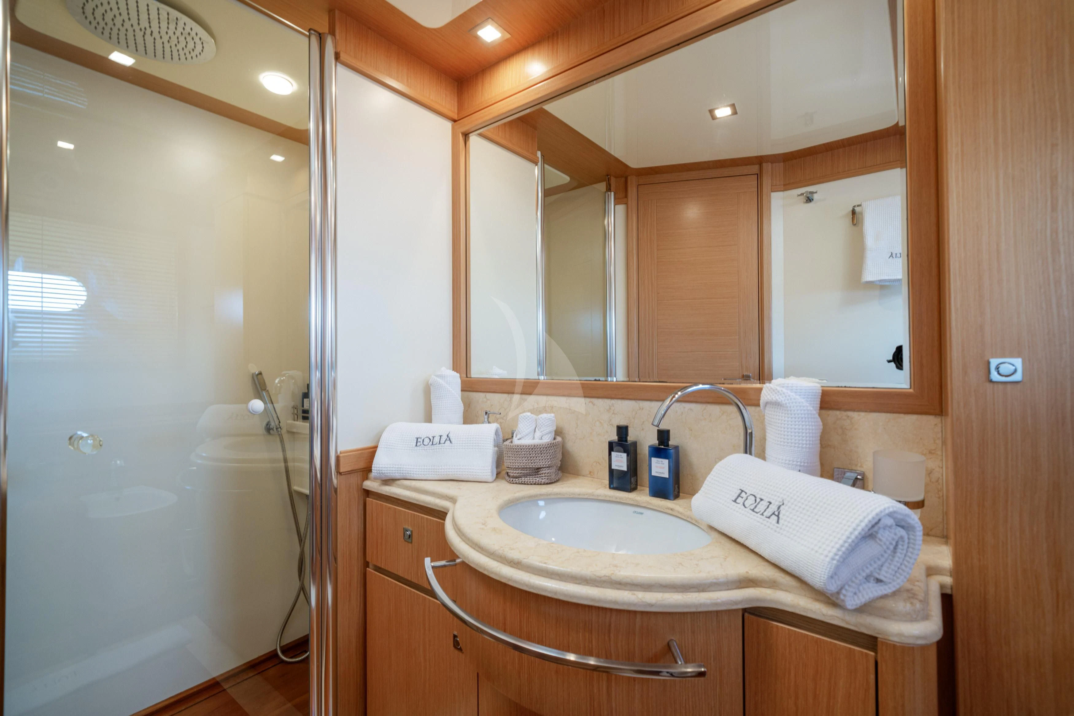 a bathroom with a sink and mirror aboard EOLIA Yacht for Sale
