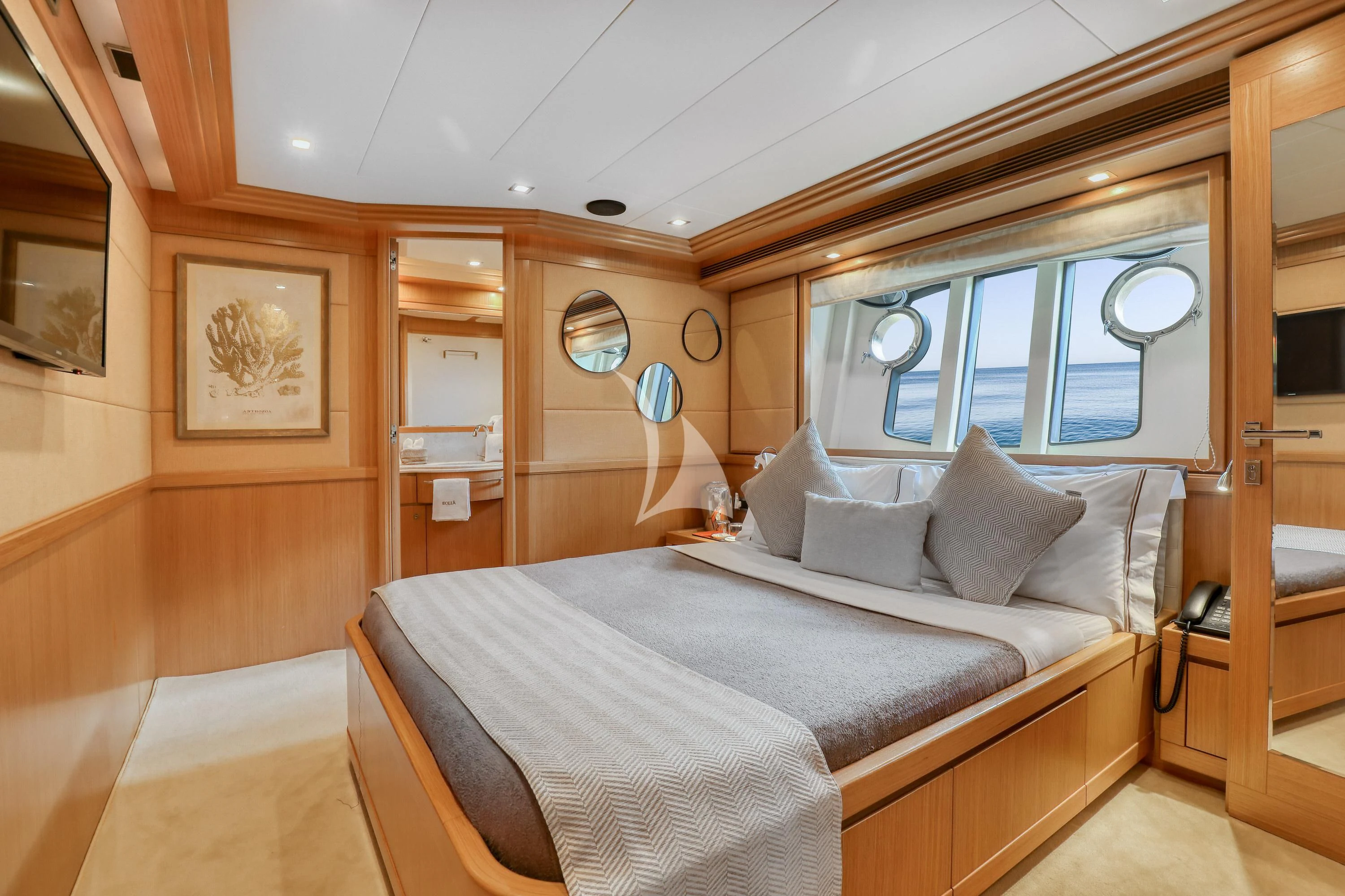 a room with a bed and a window aboard EOLIA Yacht for Sale