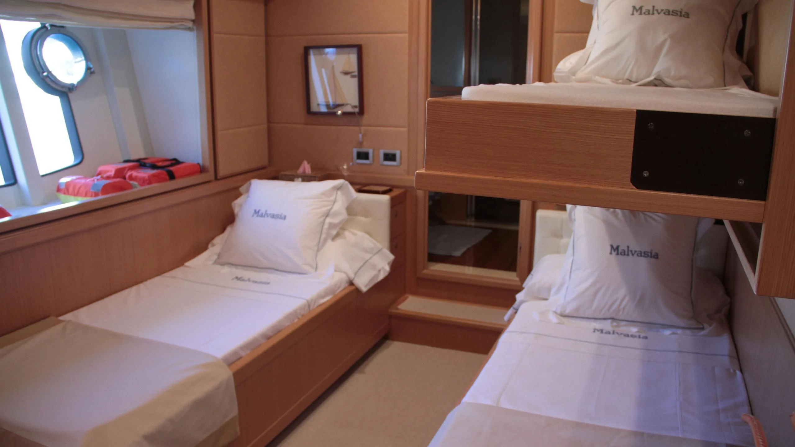 a room with beds and a tv aboard EOLIA Yacht for Sale