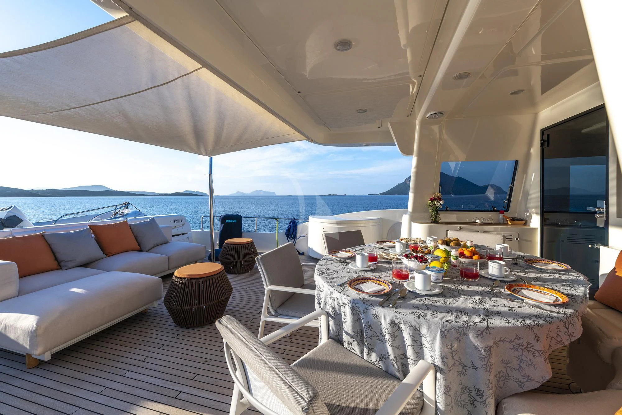 a tent with a table and chairs aboard EOLIA Yacht for Sale