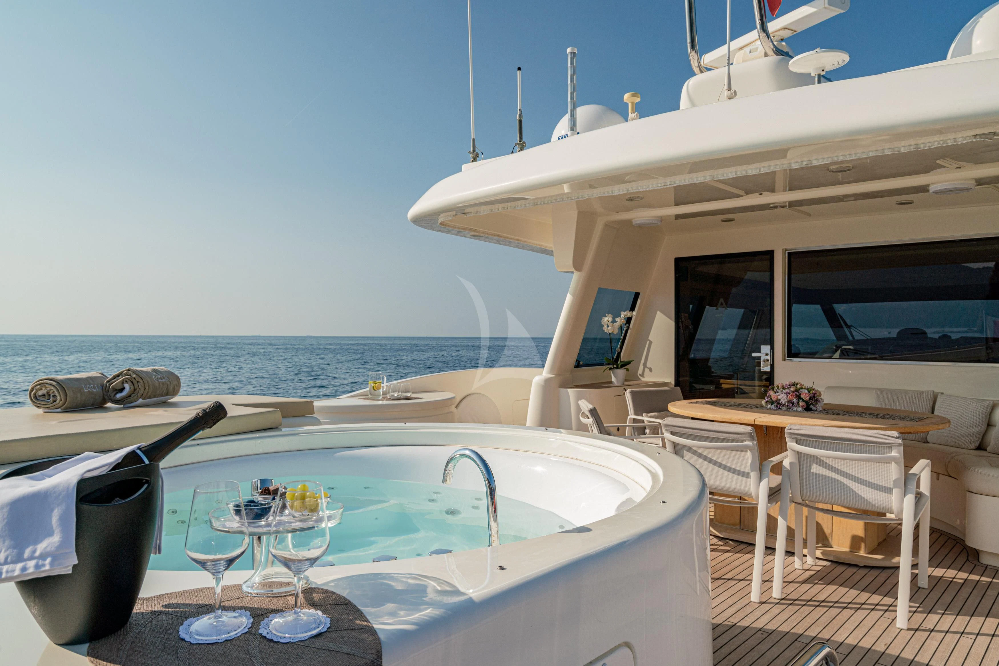 a pool with a table and chairs aboard EOLIA Yacht for Sale