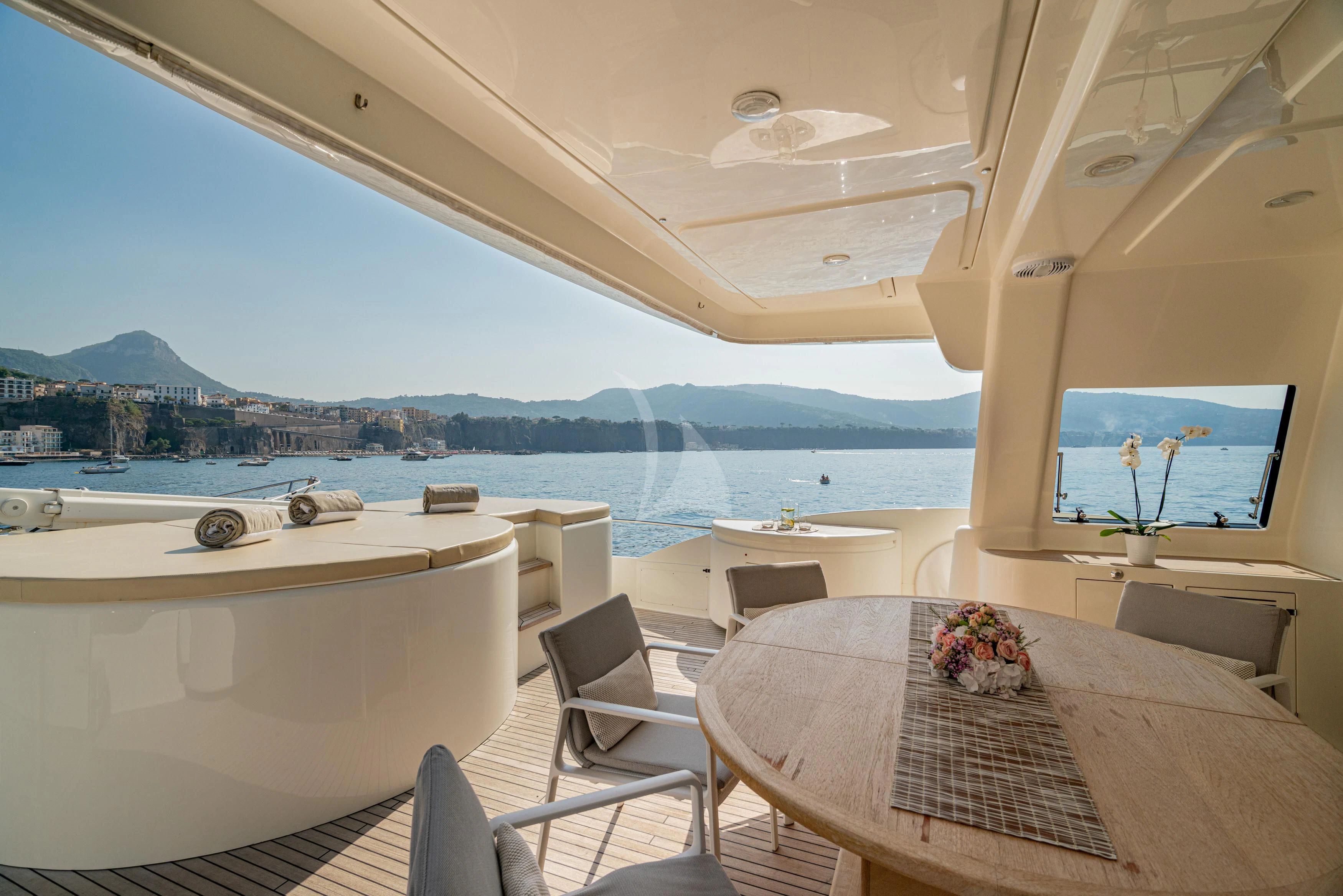 a room with a table and chairs aboard EOLIA Yacht for Sale