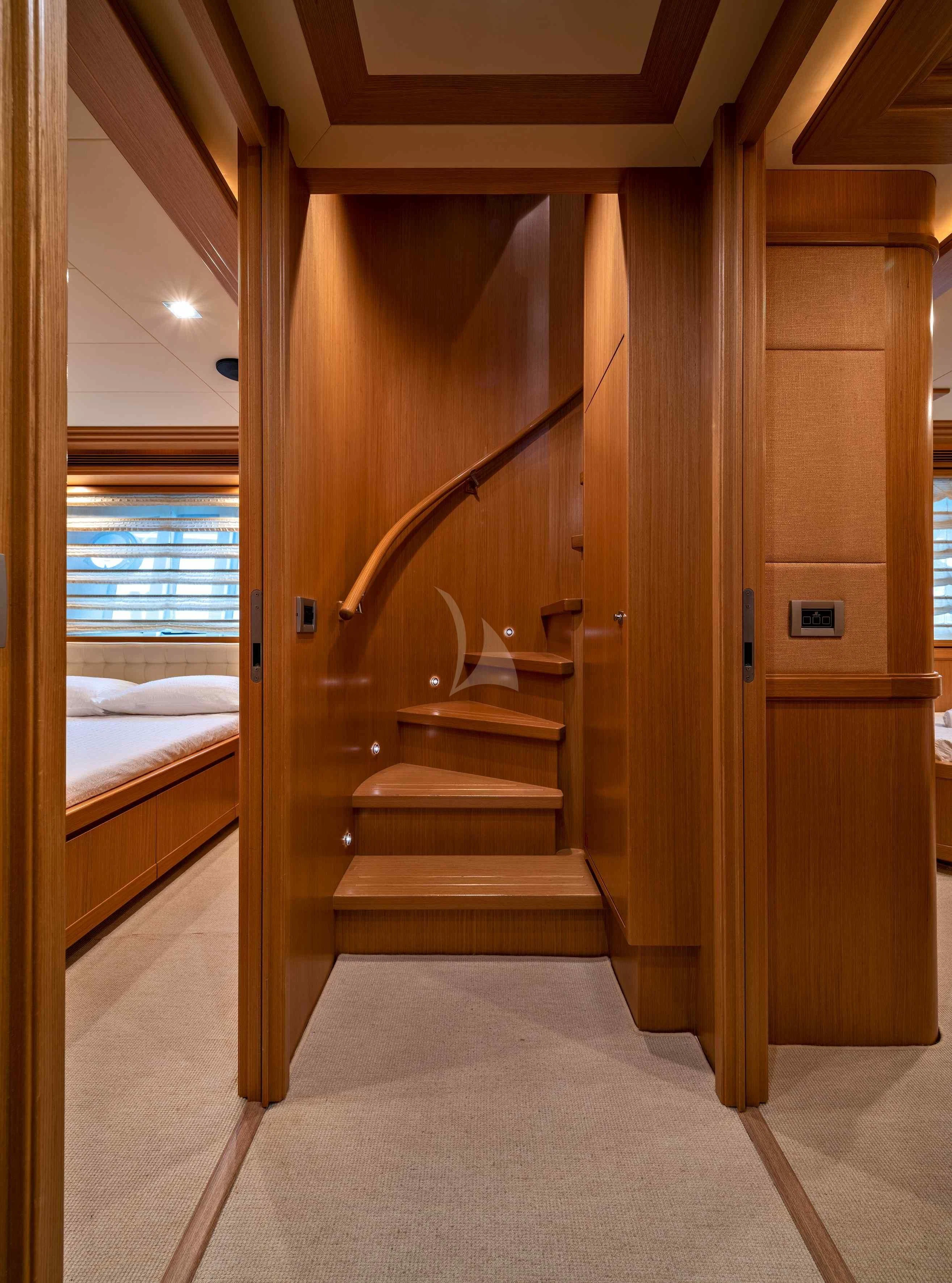 a wooden staircase in a room aboard EOLIA Yacht for Sale