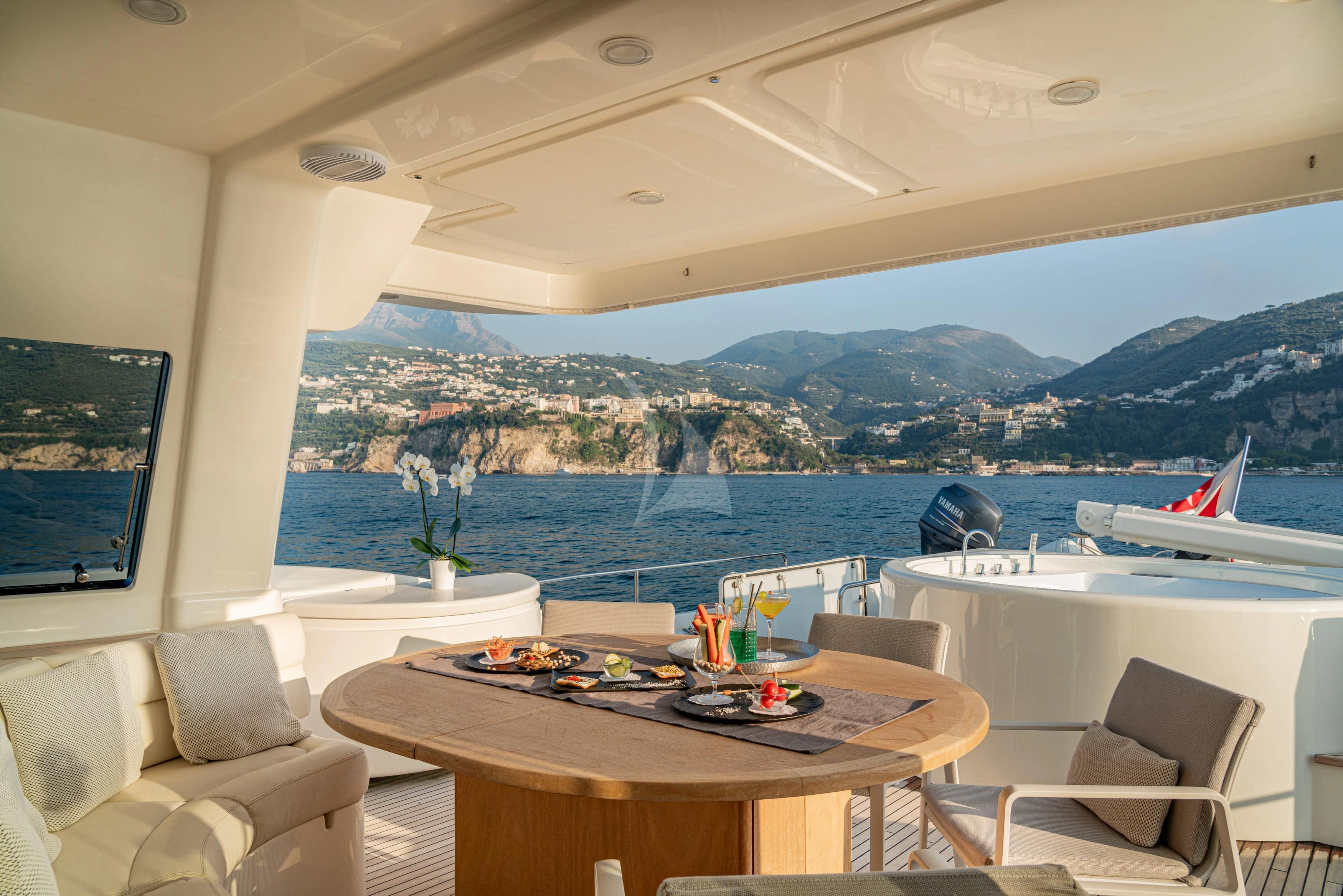 a room with a table and chairs aboard EOLIA Yacht for Sale