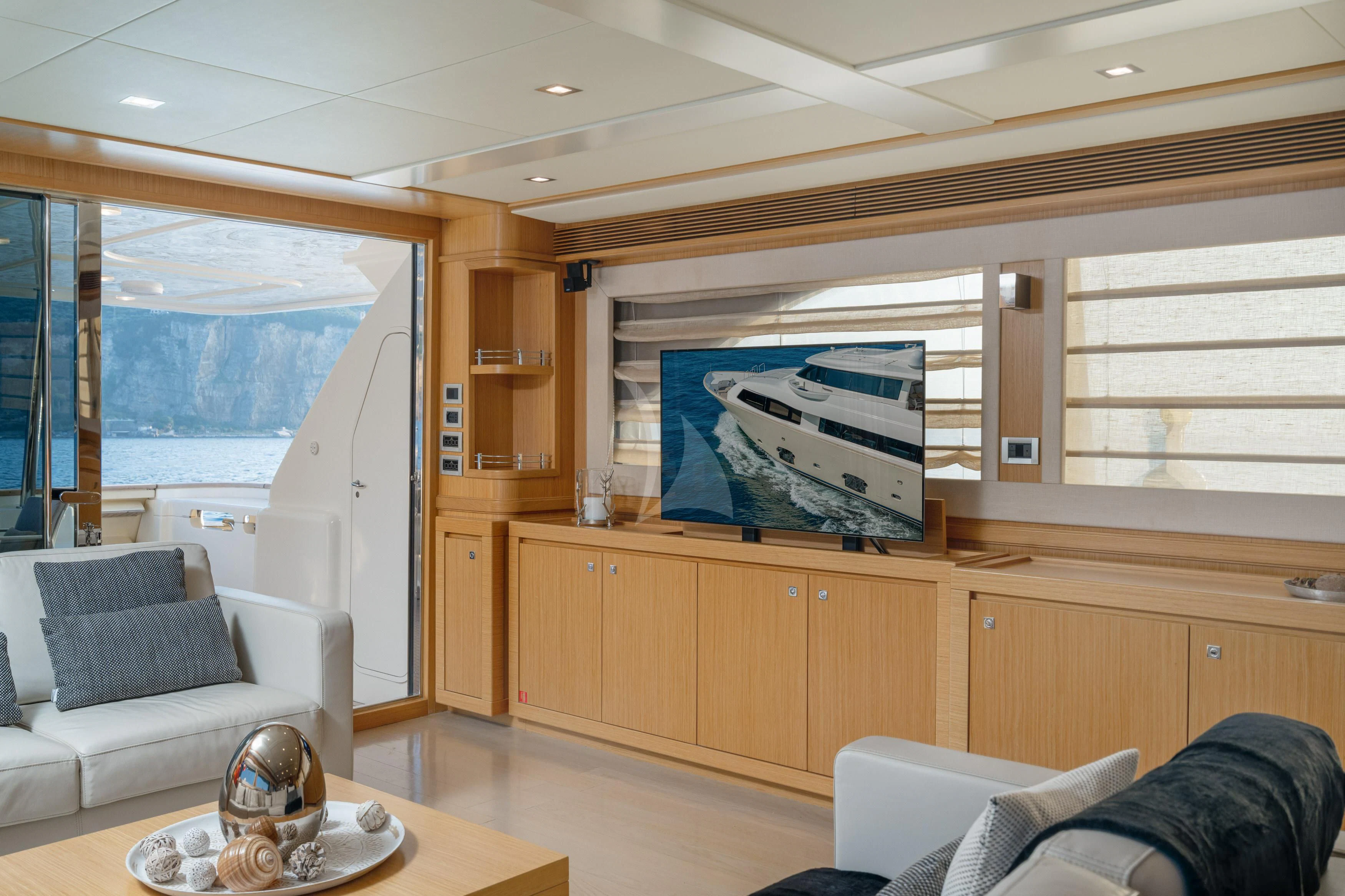 a living room with a large window aboard EOLIA Yacht for Sale