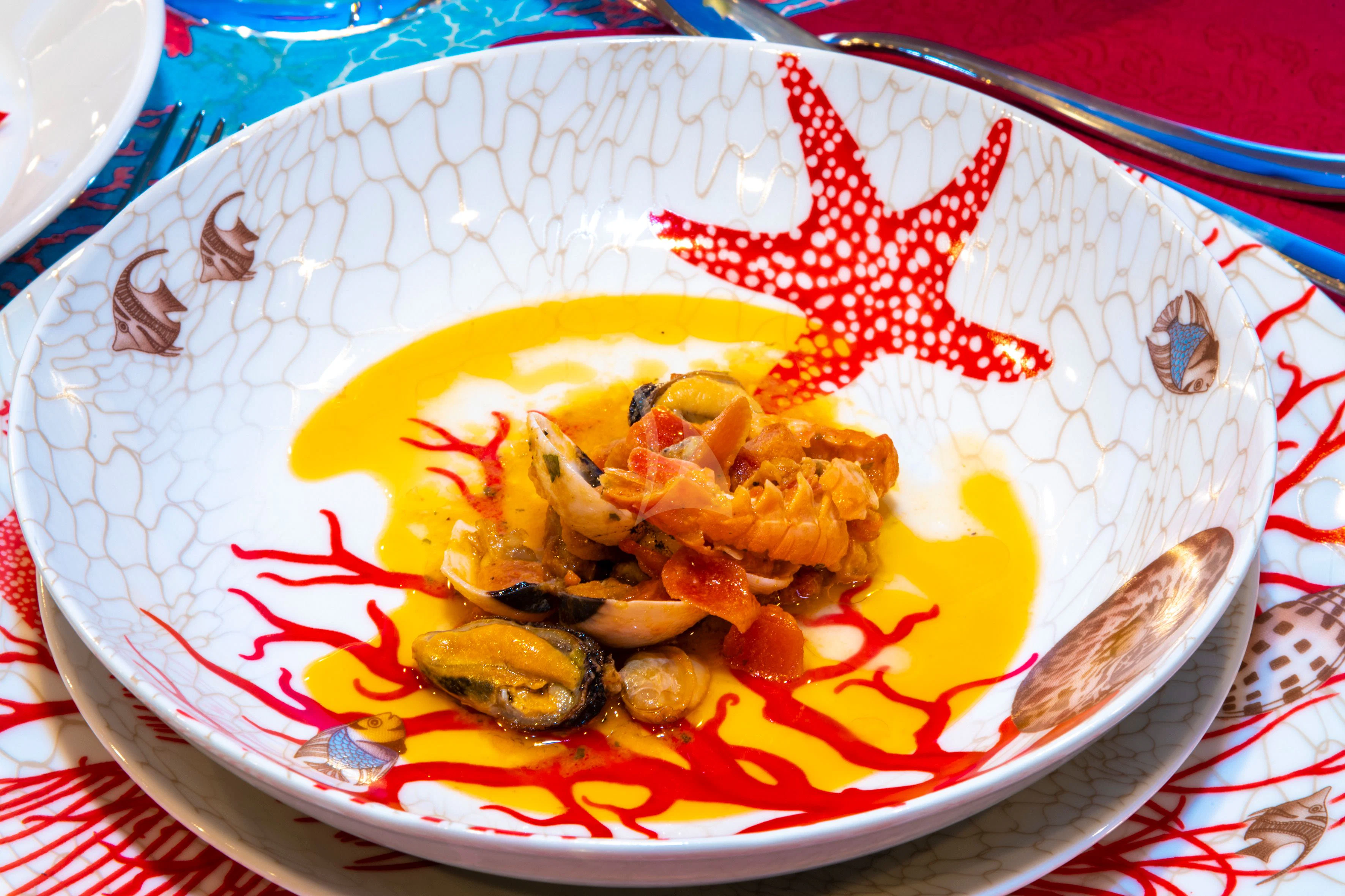 a plate of food aboard EOLIA Yacht for Sale