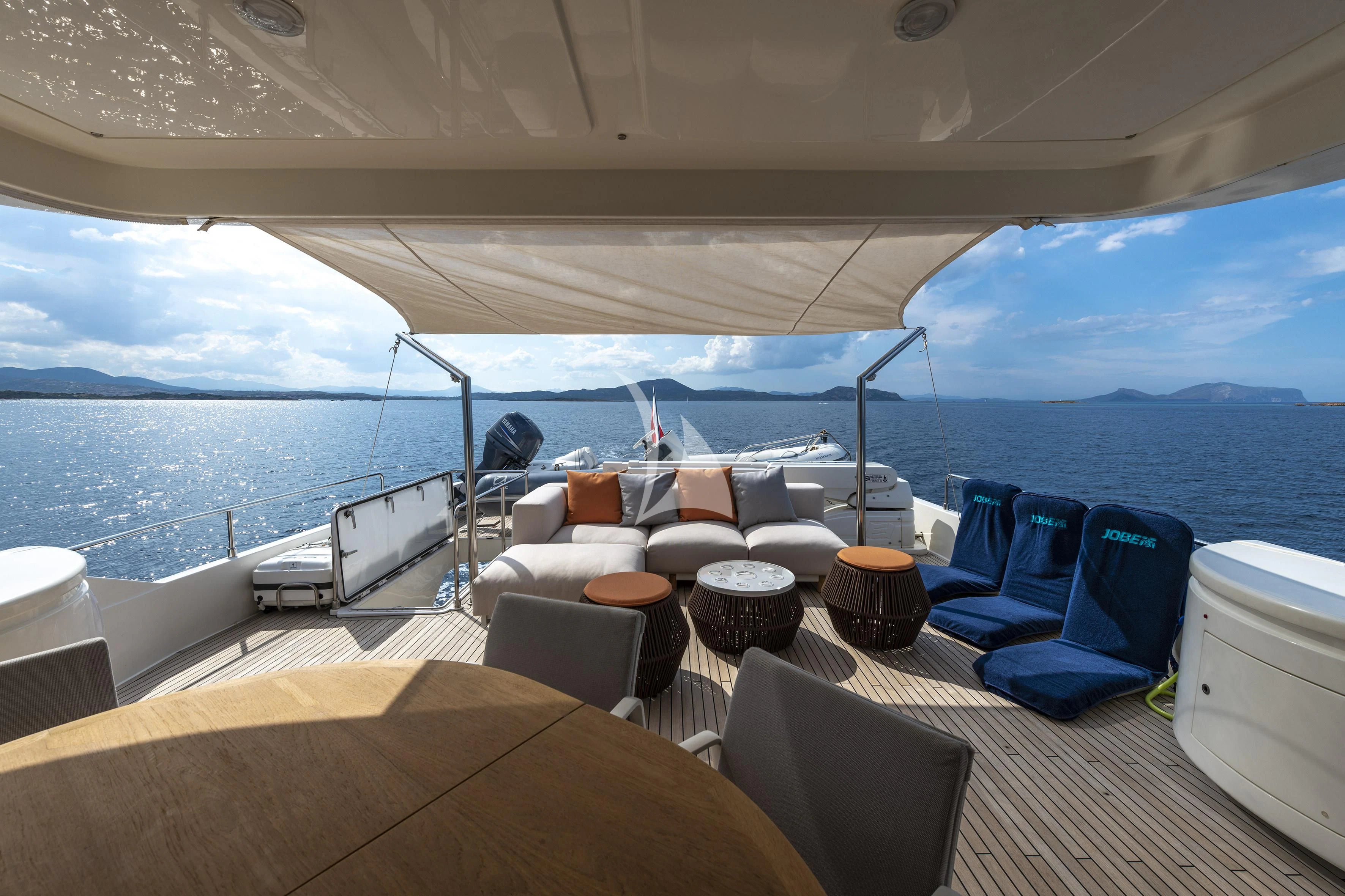 a boat with a table and chairs on it aboard EOLIA Yacht for Sale