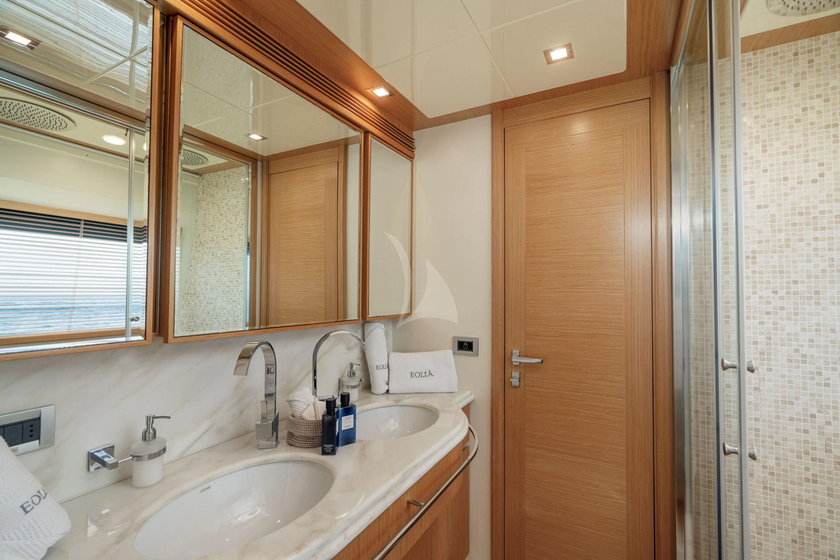 a bathroom with a sink and a mirror aboard EOLIA Yacht for Sale