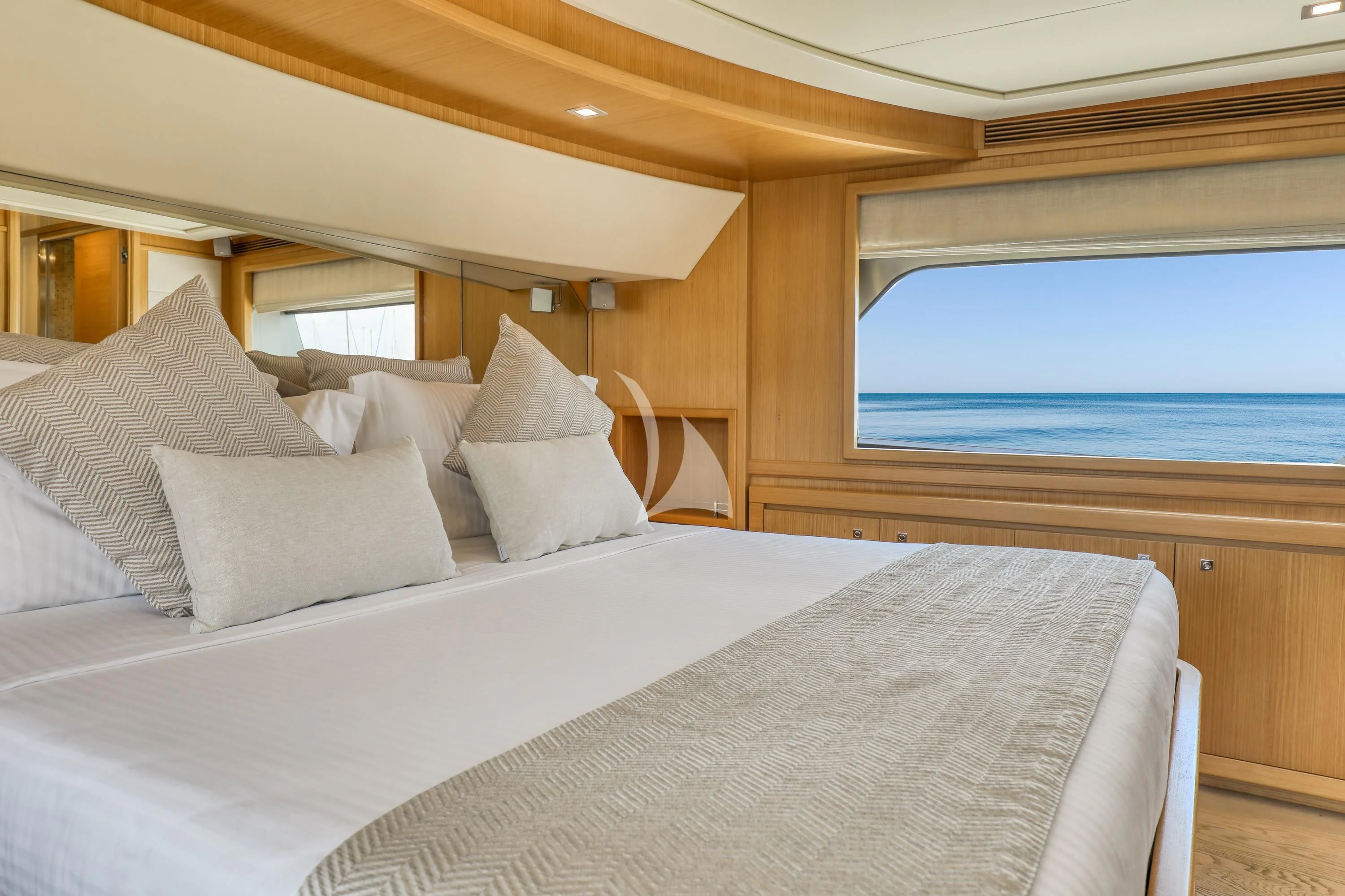 a bed with white sheets and pillows aboard EOLIA Yacht for Sale