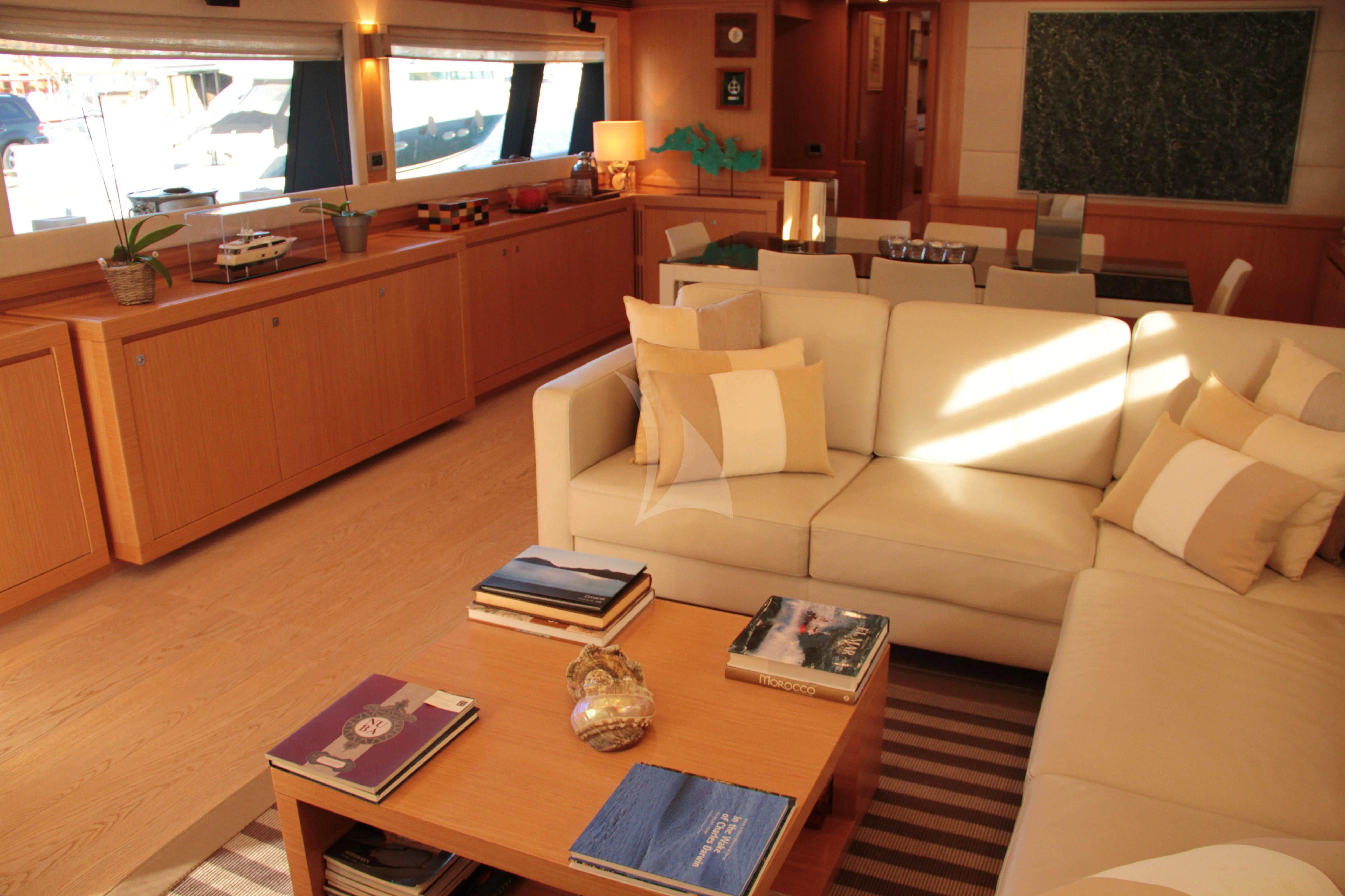 a living room with a white couch aboard EOLIA Yacht for Sale