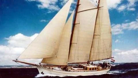 a sailboat on a beach aboard SILVER SPRAY Yacht for Sale