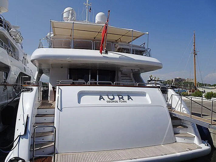 a boat docked at a pier aboard AURA Yacht for Sale
