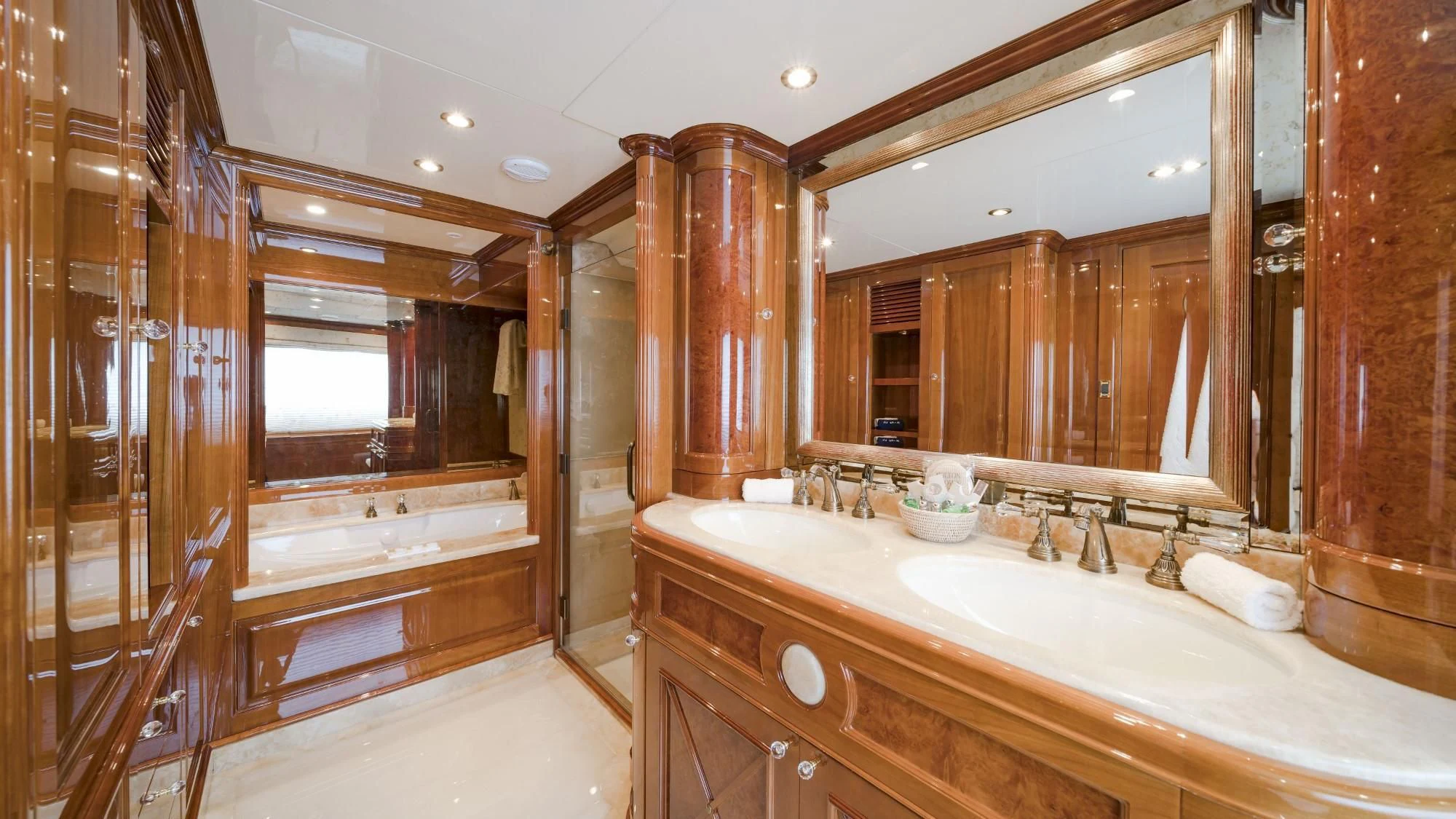 a bathroom with a large mirror aboard AURA Yacht for Sale