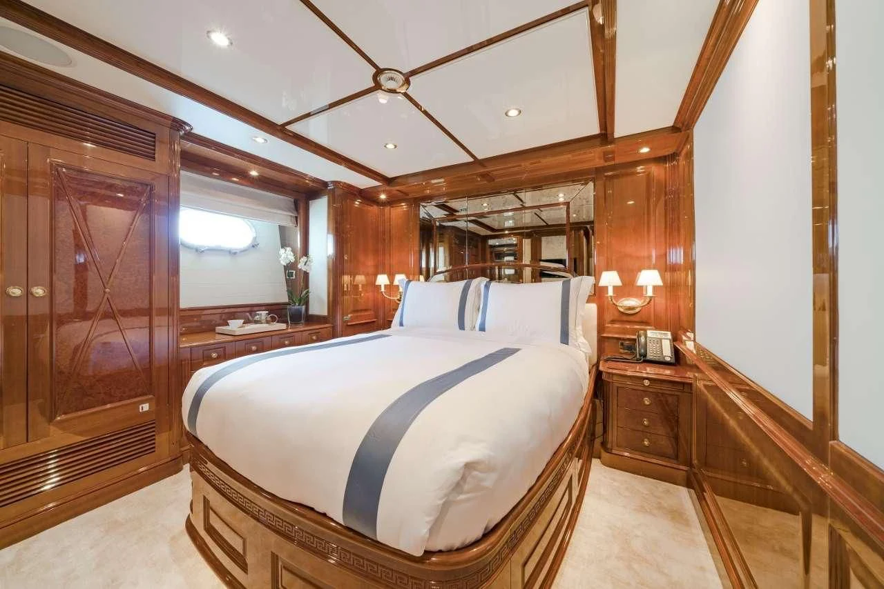a bed in a room aboard AURA Yacht for Sale