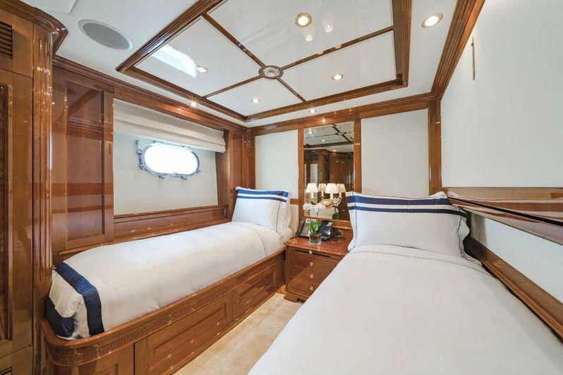 a room with two beds aboard AURA Yacht for Sale