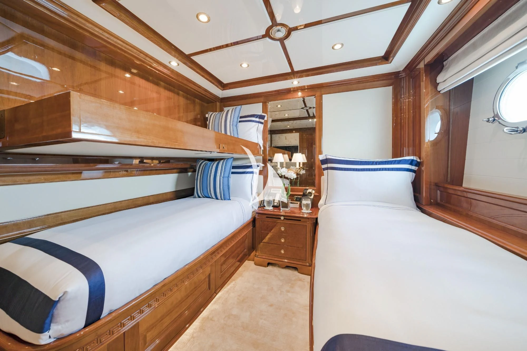 a room with bunk beds aboard AURA Yacht for Sale