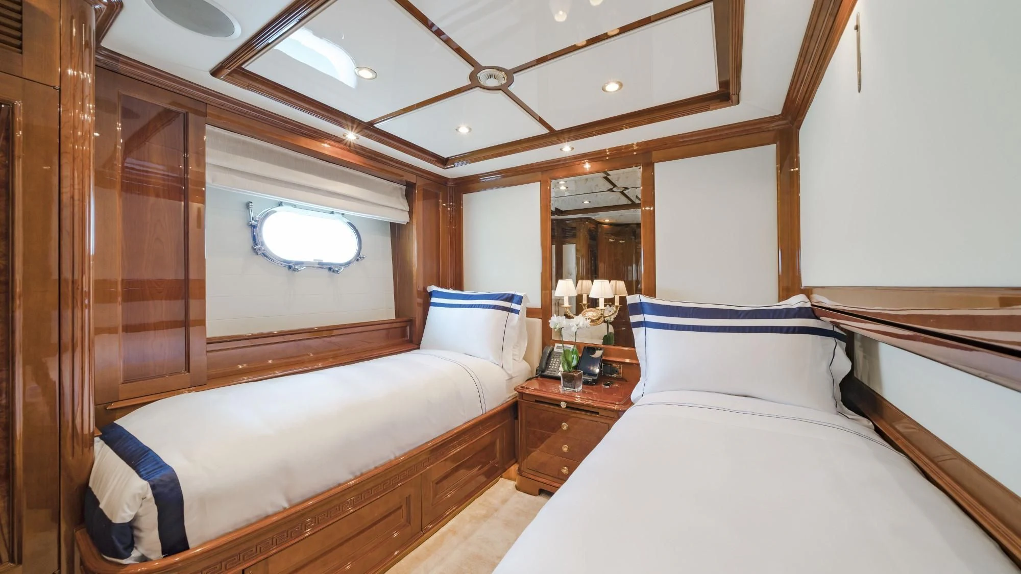 a room with two beds aboard AURA Yacht for Sale