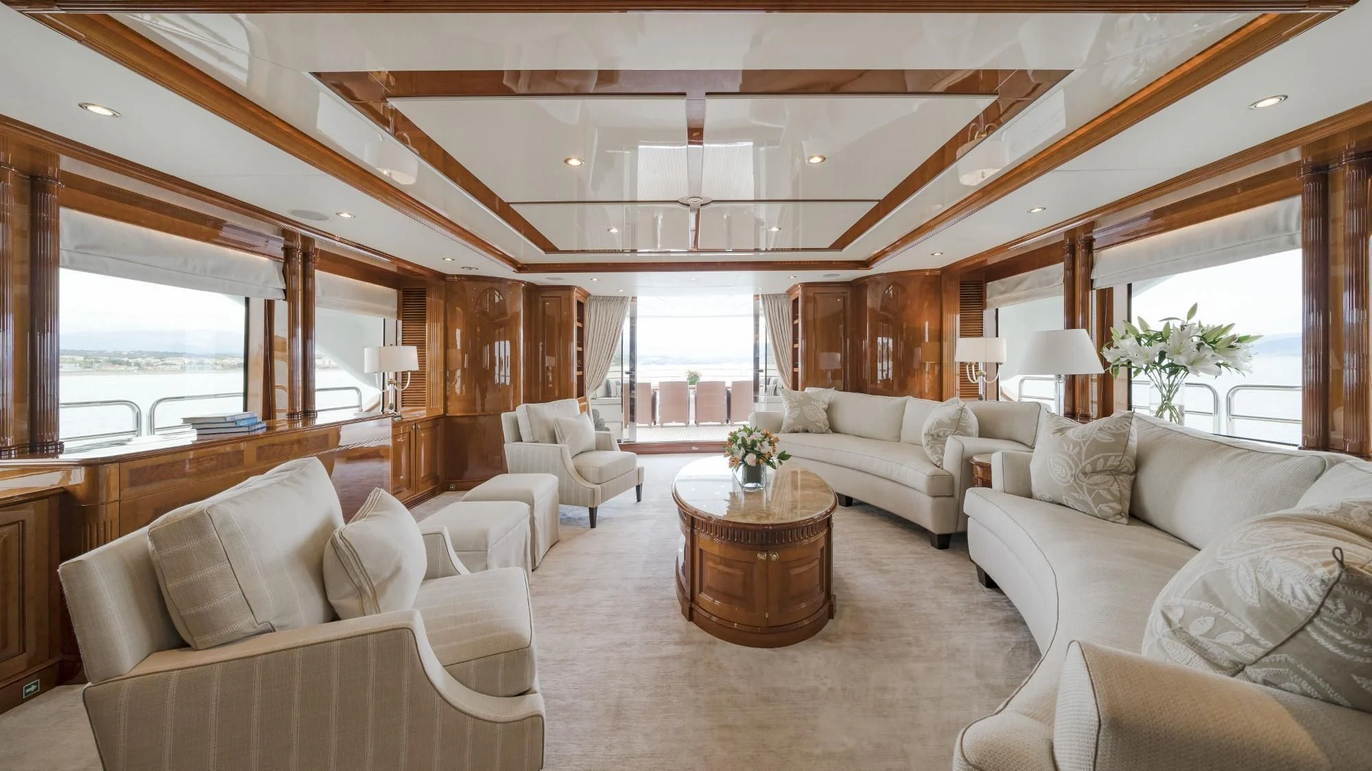 a living room with a wood ceiling aboard AURA Yacht for Sale