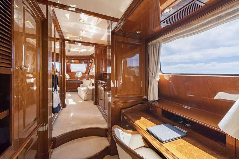 a room with a wood paneled ceiling and a window aboard AURA Yacht for Sale