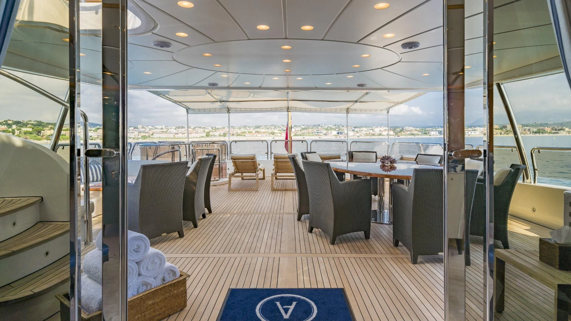 inside of a building with a table and chairs aboard AURA Yacht for Sale