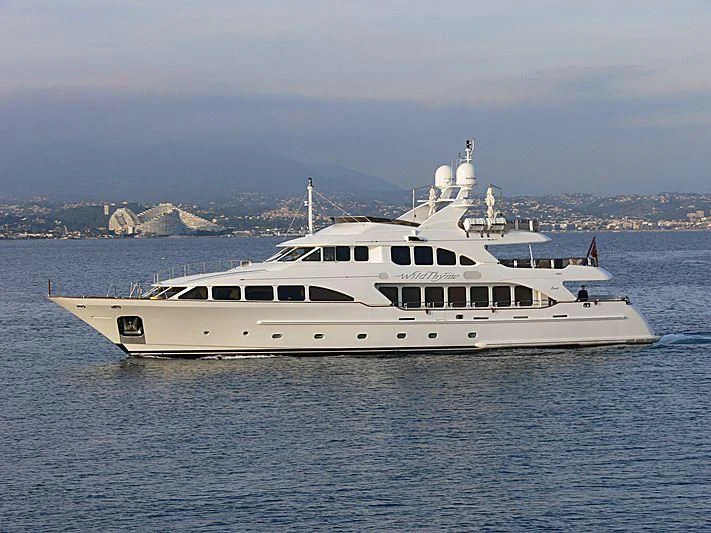 a white yacht in the water aboard AURA Yacht for Sale