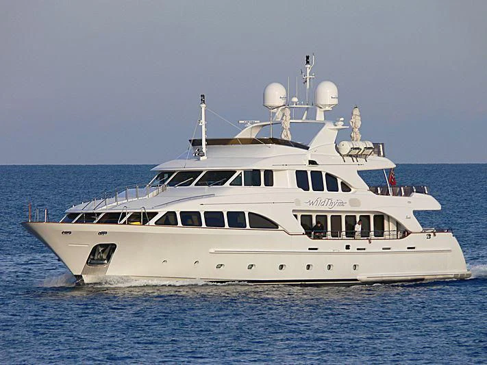 a white yacht in the water aboard AURA Yacht for Sale