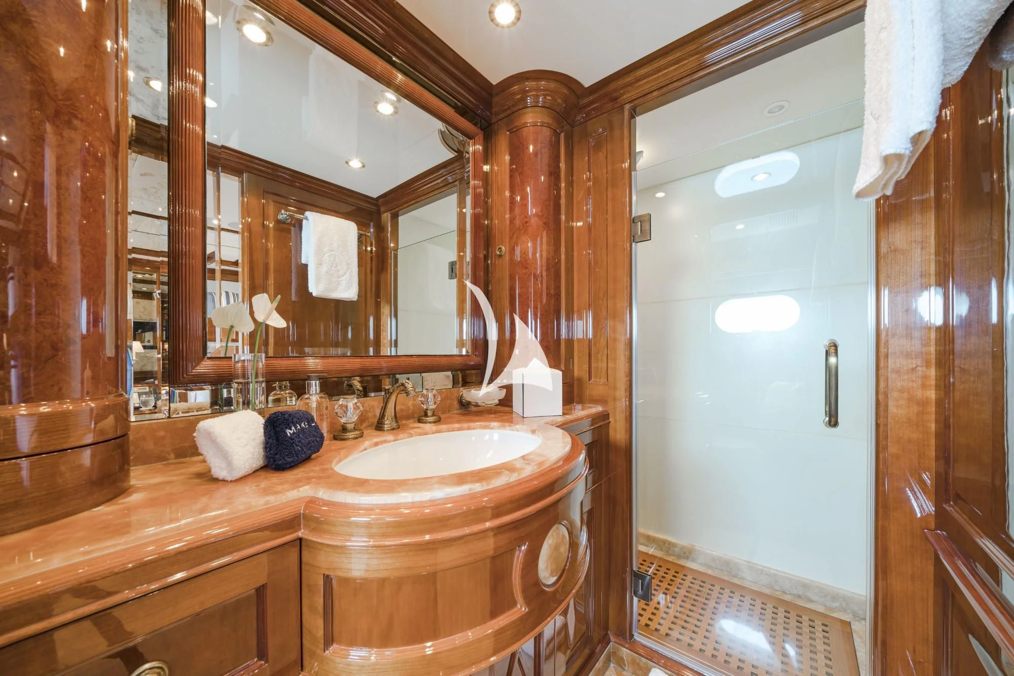 a bathroom with a large mirror aboard AURA Yacht for Sale