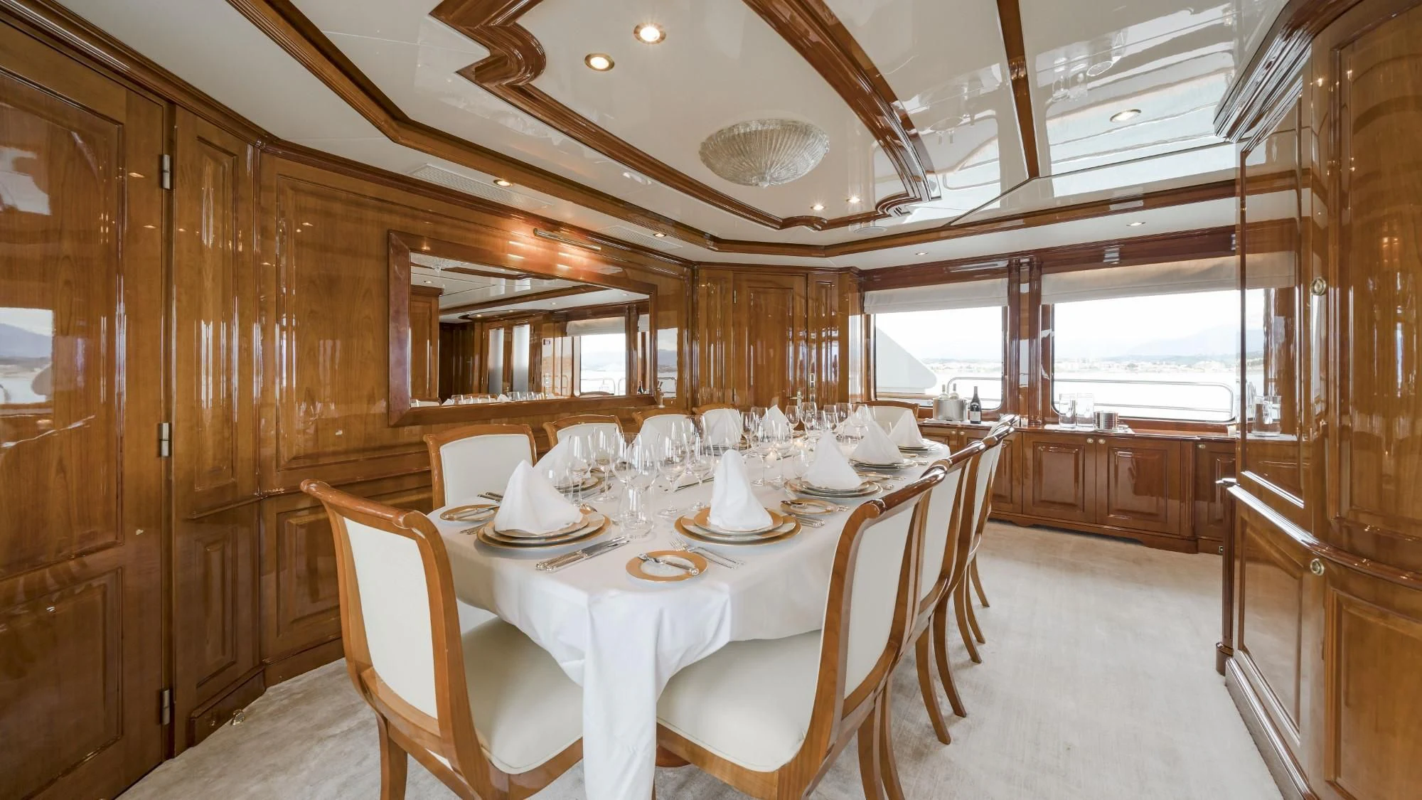 a dining room with a table aboard AURA Yacht for Sale