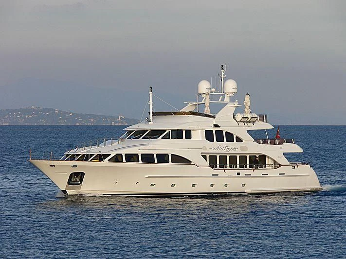 a white boat in the water aboard AURA Yacht for Sale