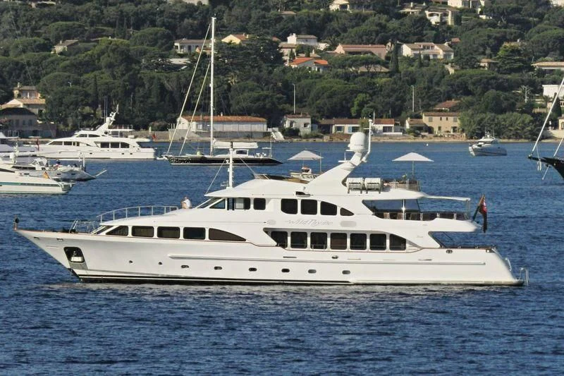 a white yacht in the water aboard AURA Yacht for Sale