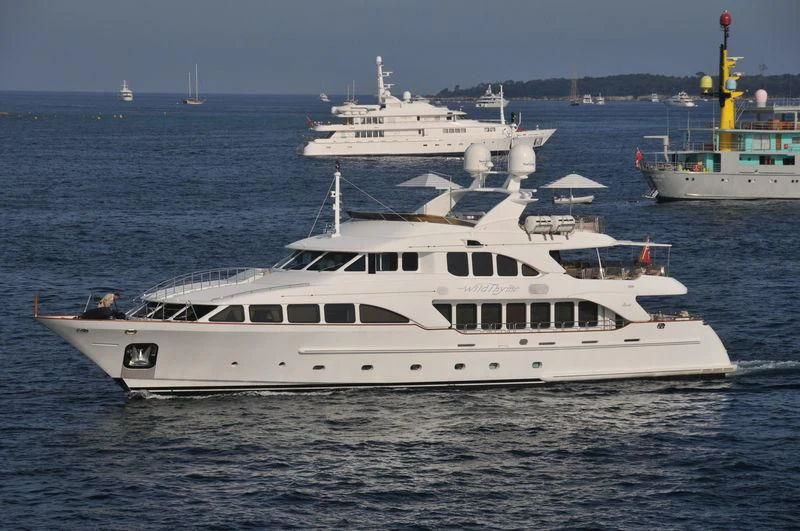 a large white boat in the water aboard AURA Yacht for Sale