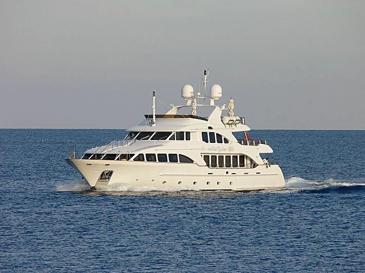 a white boat in the water aboard AURA Yacht for Sale