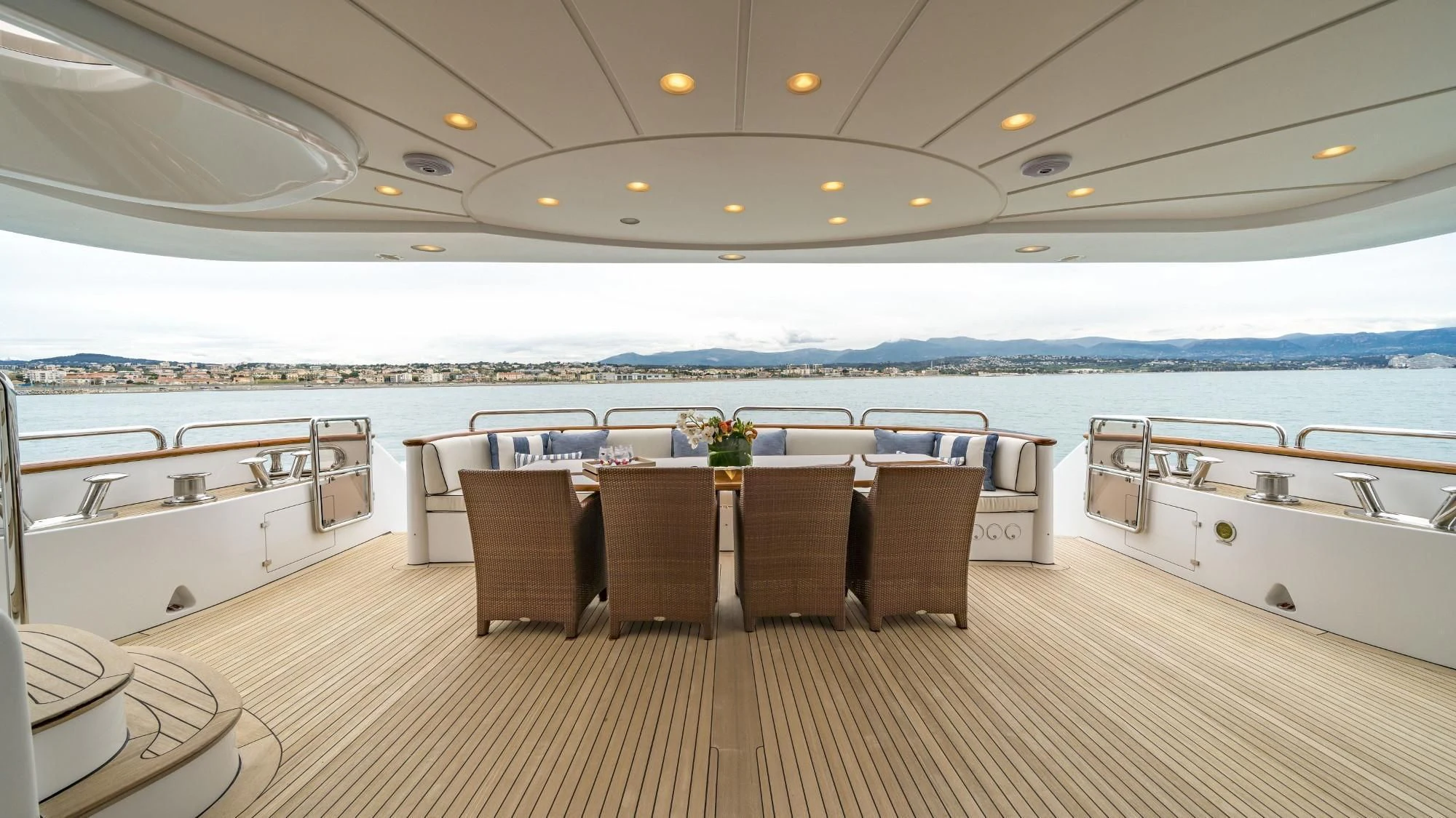 a large room with a table and chairs aboard AURA Yacht for Sale