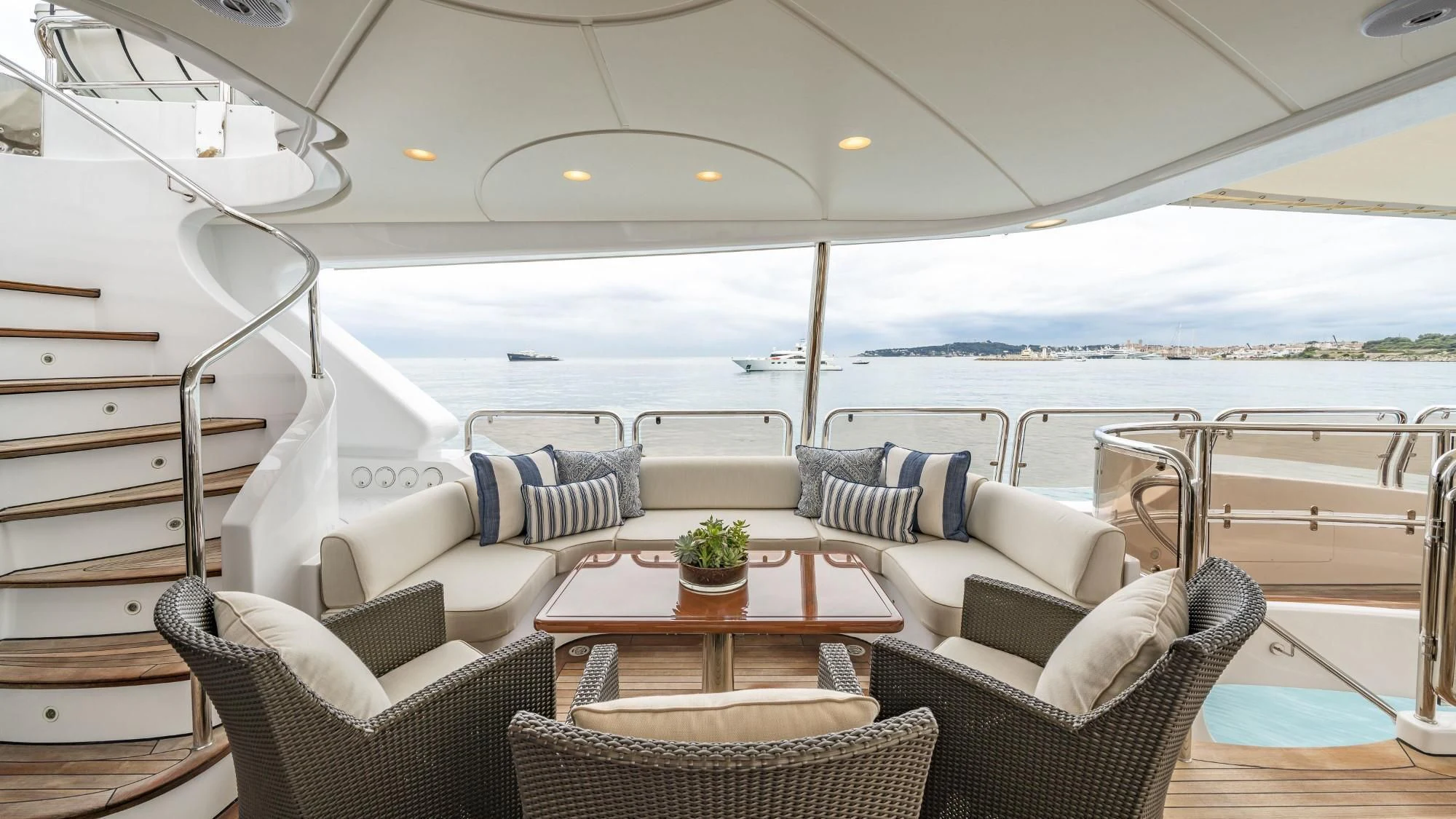 a boat with a table and chairs aboard AURA Yacht for Sale