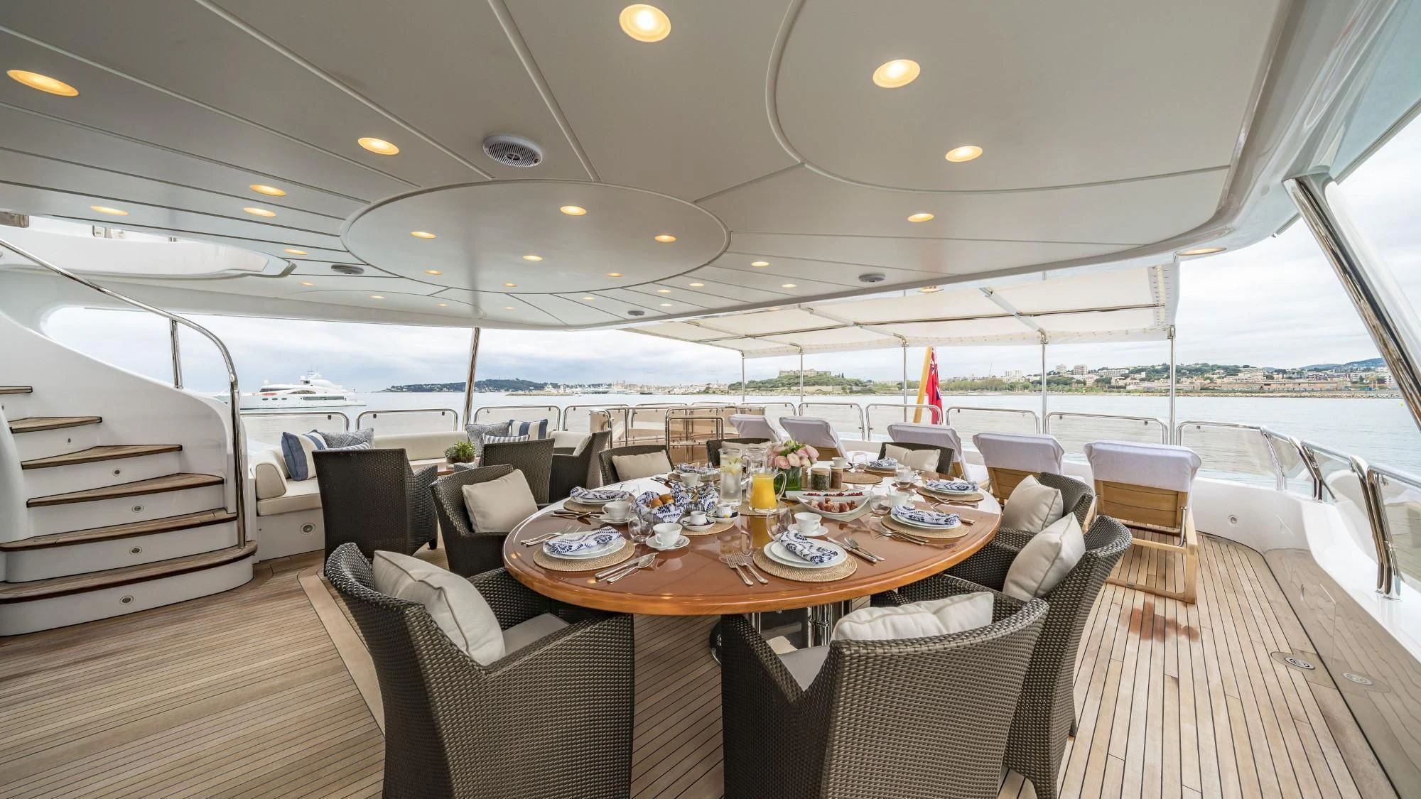 a large dining table on a boat aboard AURA Yacht for Sale