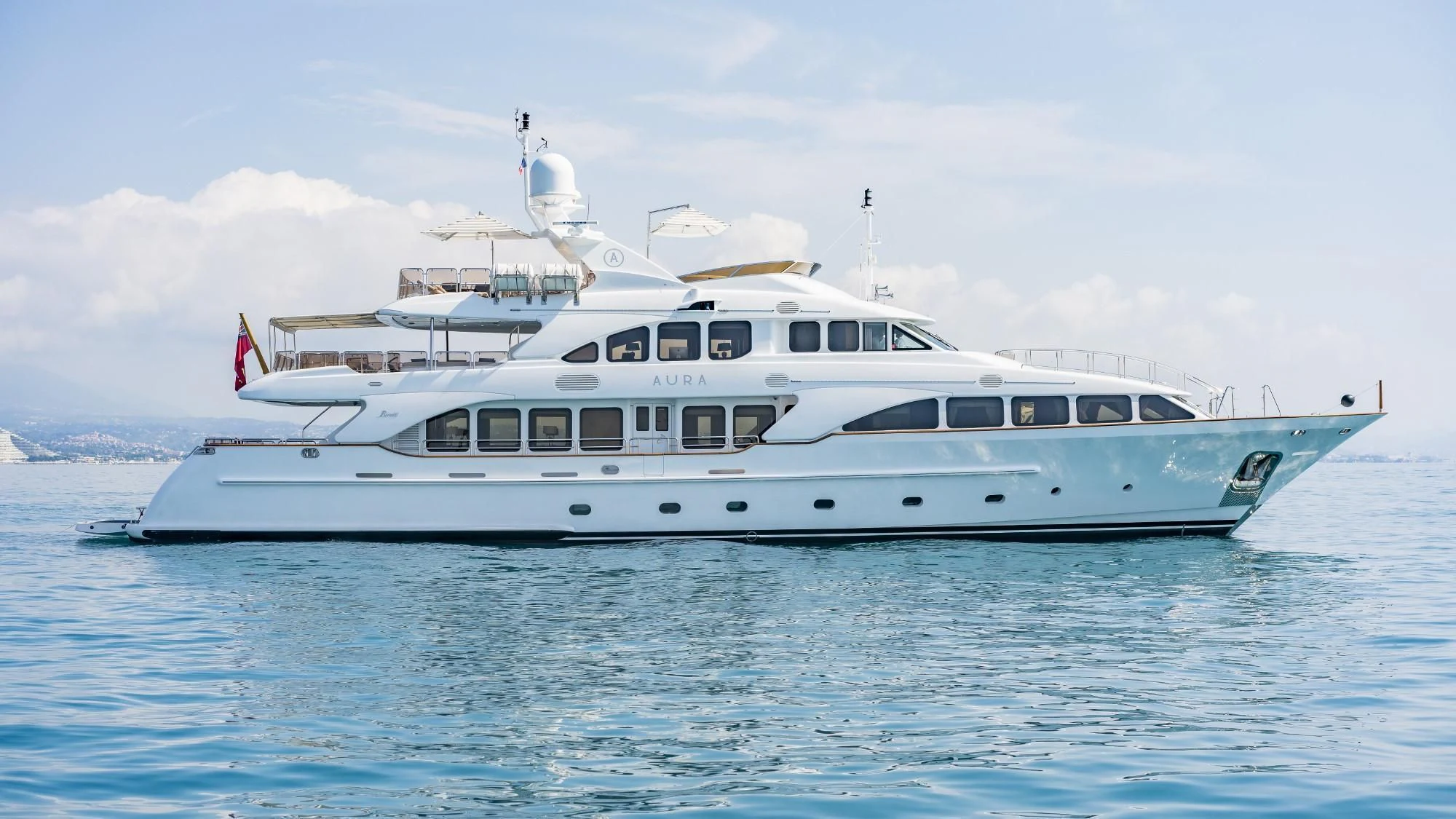 a white yacht in the water aboard AURA Yacht for Sale