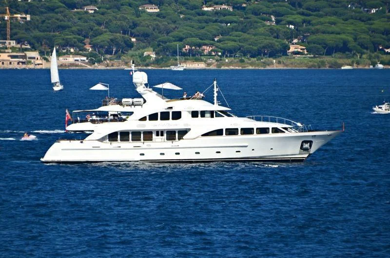 a white yacht in the water aboard AURA Yacht for Sale