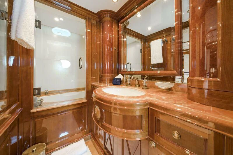 a bathroom with a sink and a mirror aboard AURA Yacht for Sale