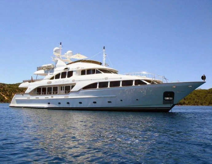 a white boat on the water aboard AURA Yacht for Sale