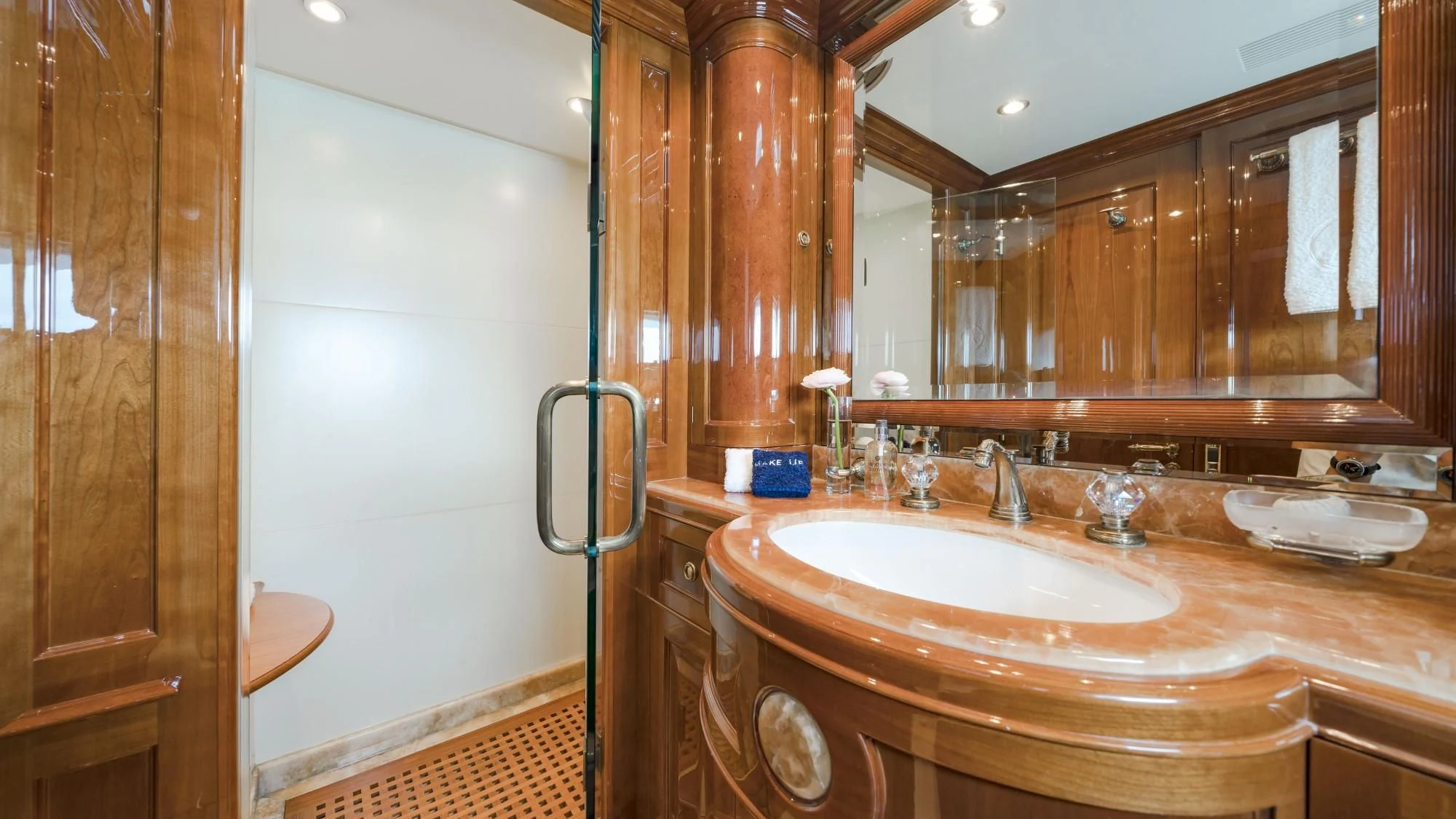a bathroom with a sink and a mirror aboard AURA Yacht for Sale
