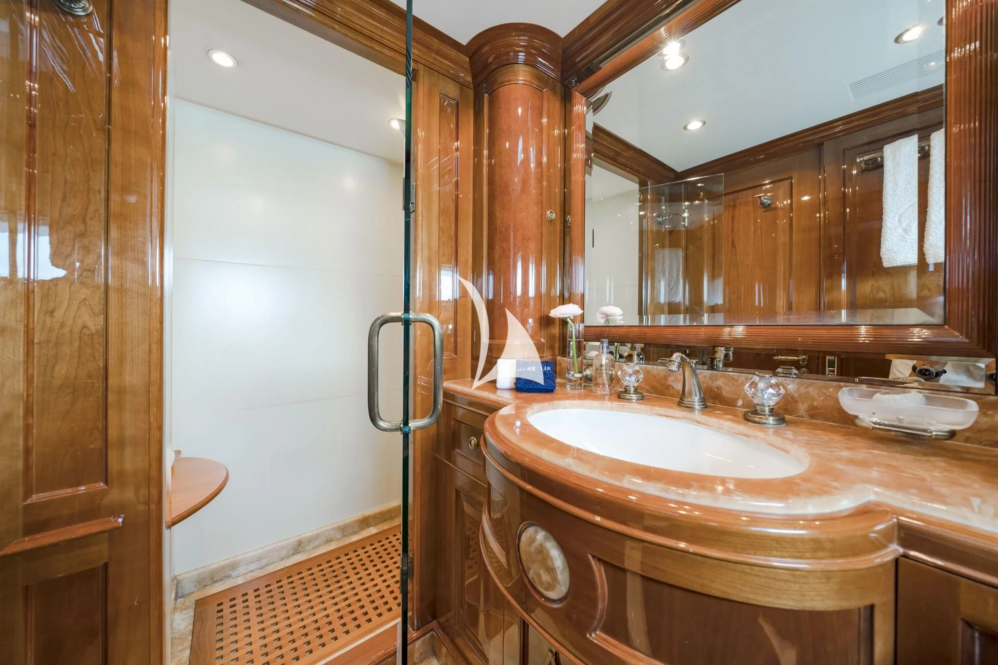 a bathroom with a sink and mirror aboard AURA Yacht for Sale
