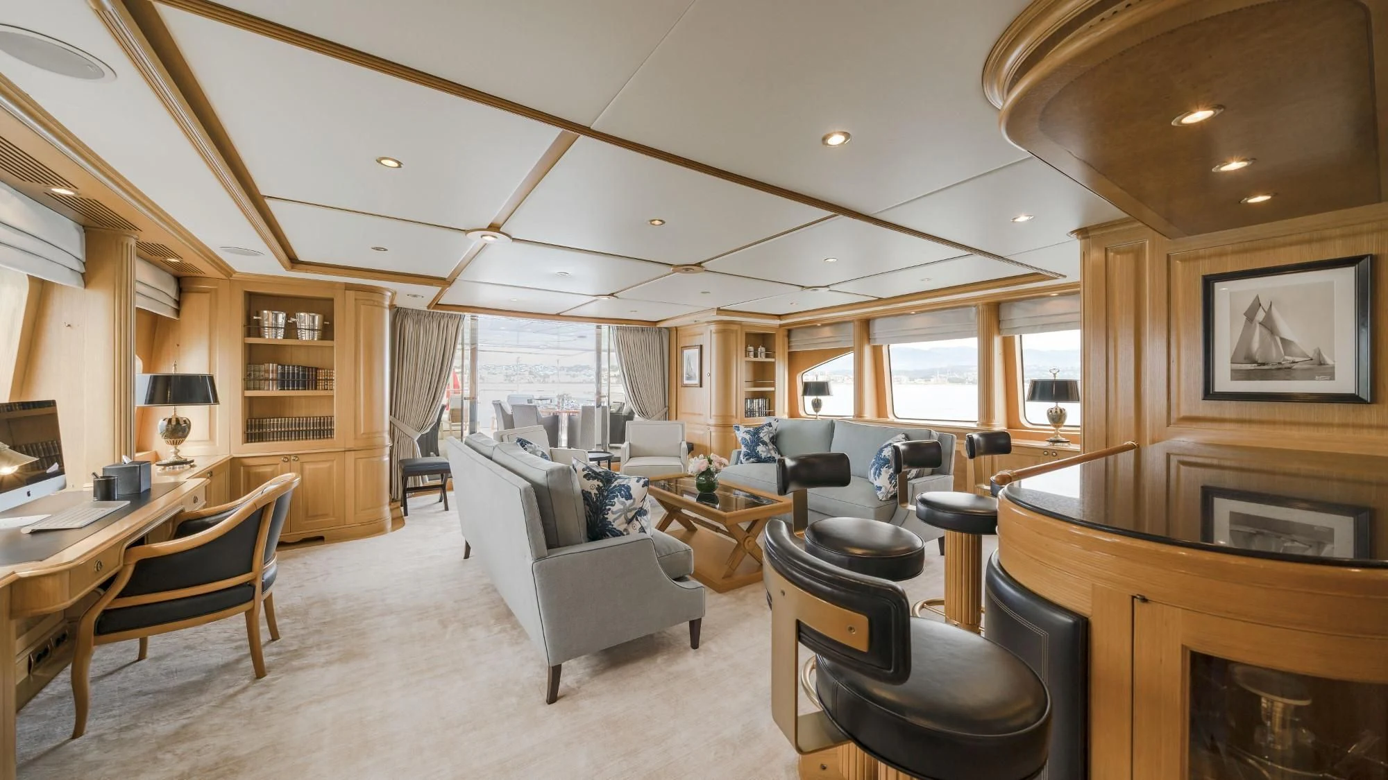 a living room with a fireplace aboard AURA Yacht for Sale